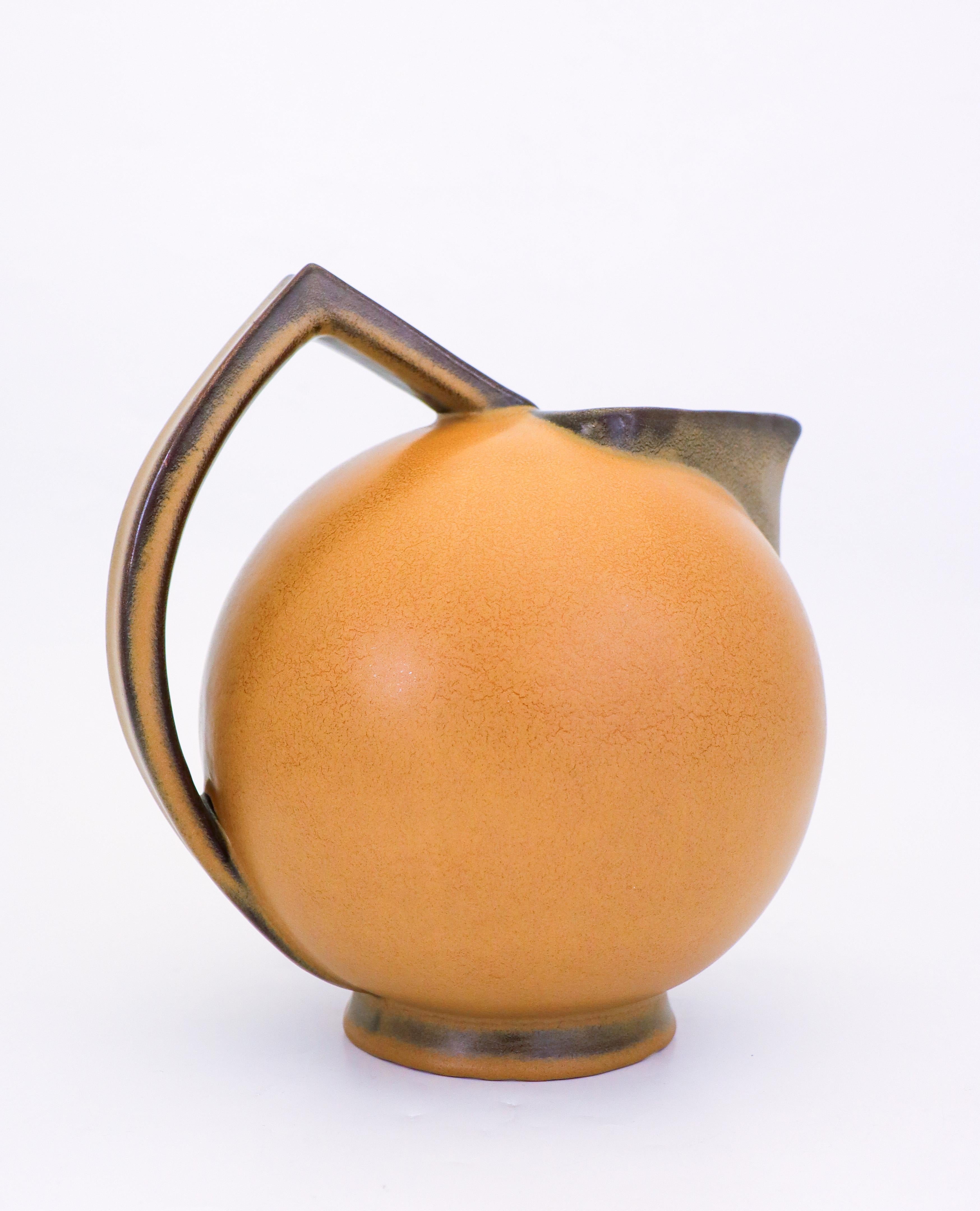 A lovely pitcher designed by Ewald Dahlskog in the 1930s at Bo Fajans in Gefle, Sweden. It is 26.5 cm high and in very good condition.

Ewald Dahlskog, born in 1880, was a pioneering Swedish designer and furniture designer. His works are
