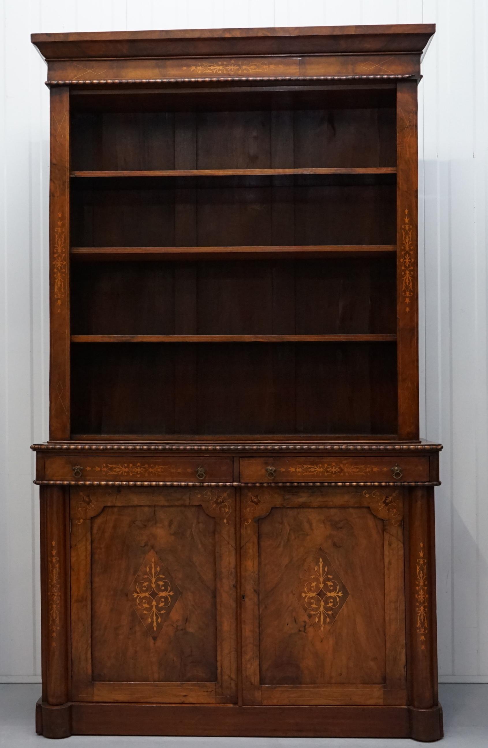 We are delighted to offer for sale this beautiful early Victorian Redwood with Marquetry inlay Library bookcase with Pugin style handles

A very good looking and grand functional piece of furniture, the timber patina is to die for as is the