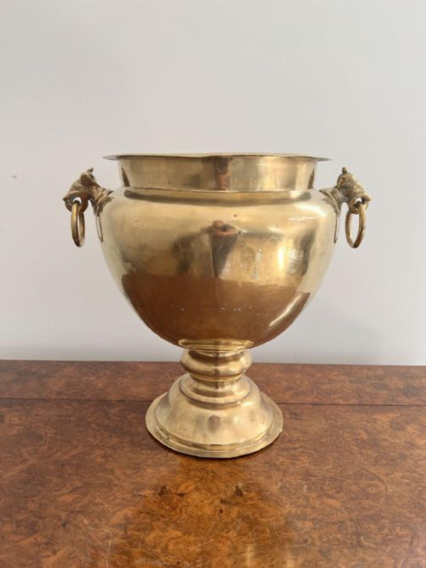 Lovely quality antique Victorian brass champagne bucket on a stand having a superb quality antique Victorian champagne bucket on a stand with a circular brass champagne bucket with lion heads ring handles to both sides, supported on a turned