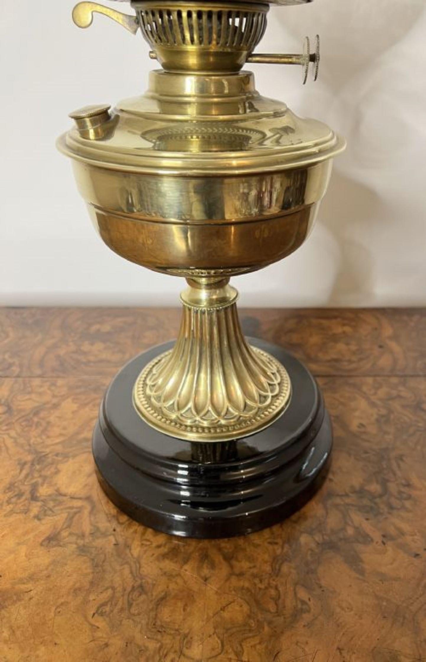 Lovely quality antique Victorian brass oil lamp having a quality Victorian oil lamp with a etched glass globe shade, glass chimney, double burner and a brass column standing on a circular base.