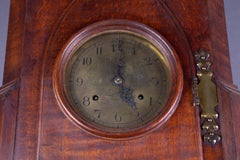 Arts and Crafts Oak Bracket Clock with Brass Dial with castellated turrets