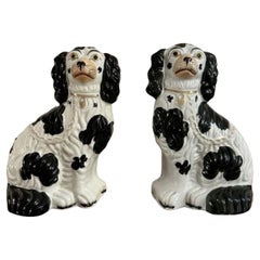 Lovely quality pair of antique black and white Staffordshire dogs