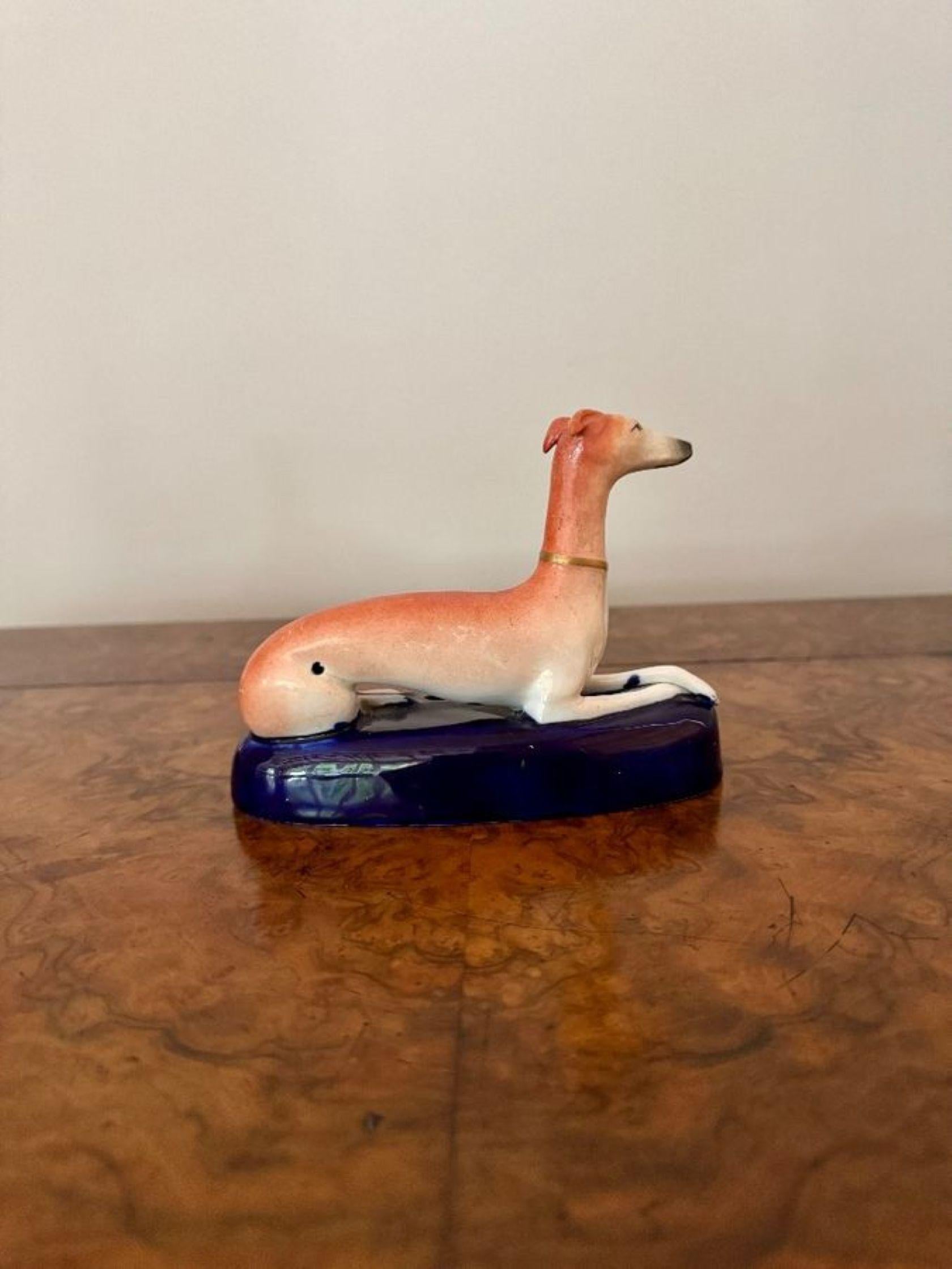 Lovely quality pair of antique Victorian Staffordshire greyhound inkwells, having a pair of greyhounds laying down with matching collars and a hole to the front for a pen, on a blue gilded shaped base hand painted in wonderful in brown, orange, blue