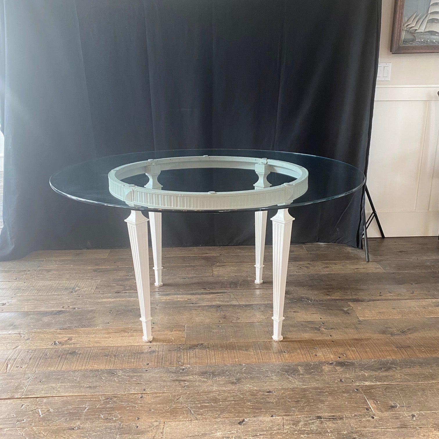 Classic French Louis XVI round glass and metal indoor or outdoor dining table or garden table. Strong and durable with really great lines! The glass top is 54