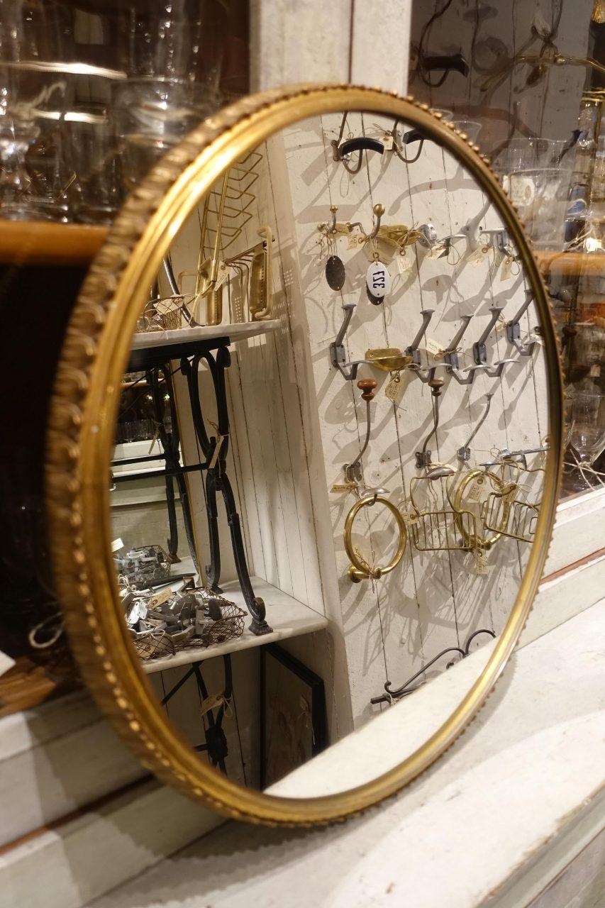 Gorgeous round Italian mirror from the 1950s. Stunning ornamentation on the depth of the edge. Stylistically similar to designer Gio Ponti’s brass mirrors. Notice the quality elegant brass profile.