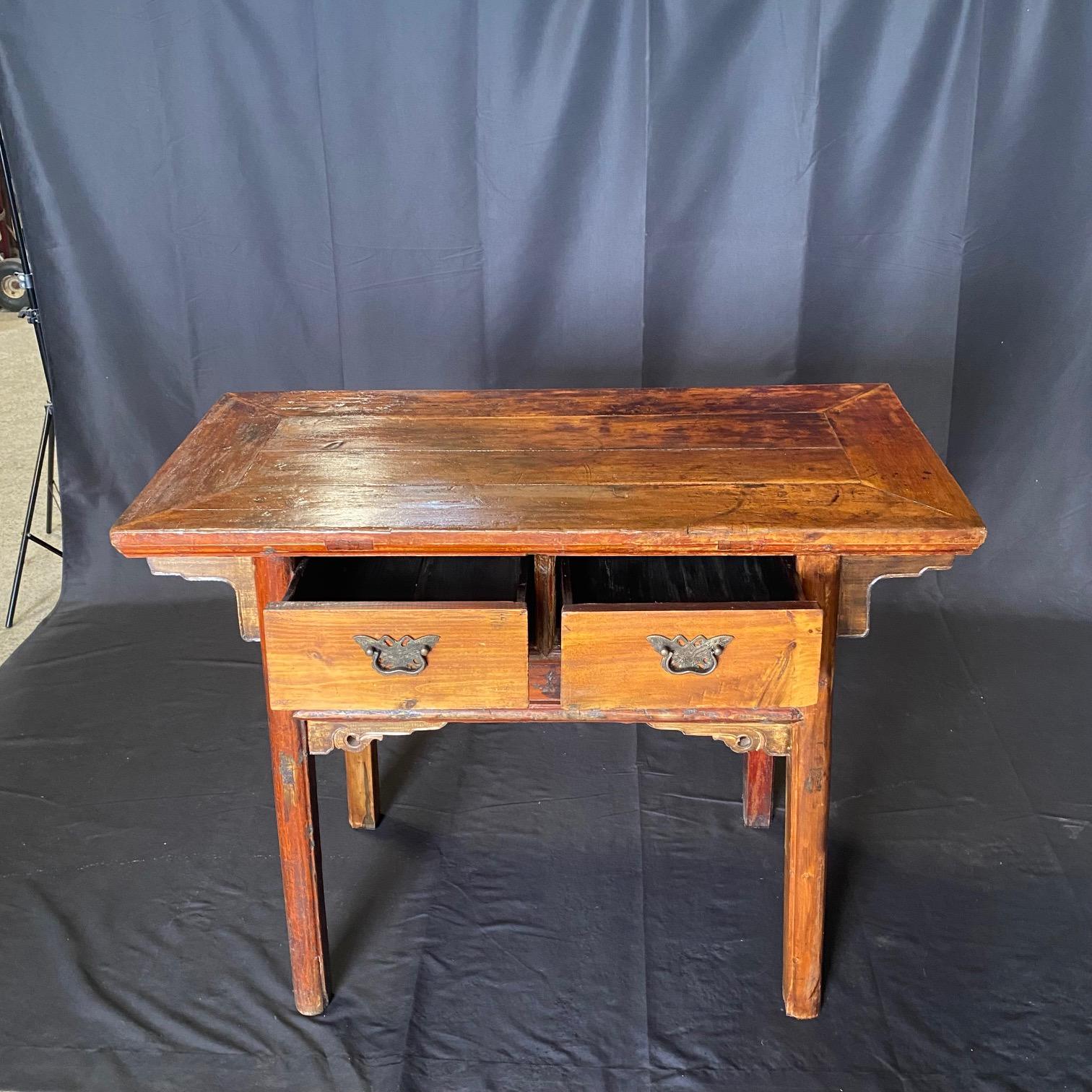 Lovely and rustic console, side table or accent table with a balanced form and timeless rustic appeal. Beautifully worn from a century of use, the aged wood patina adds rich texture to the home. It can be used as a side table, end table, buffet or