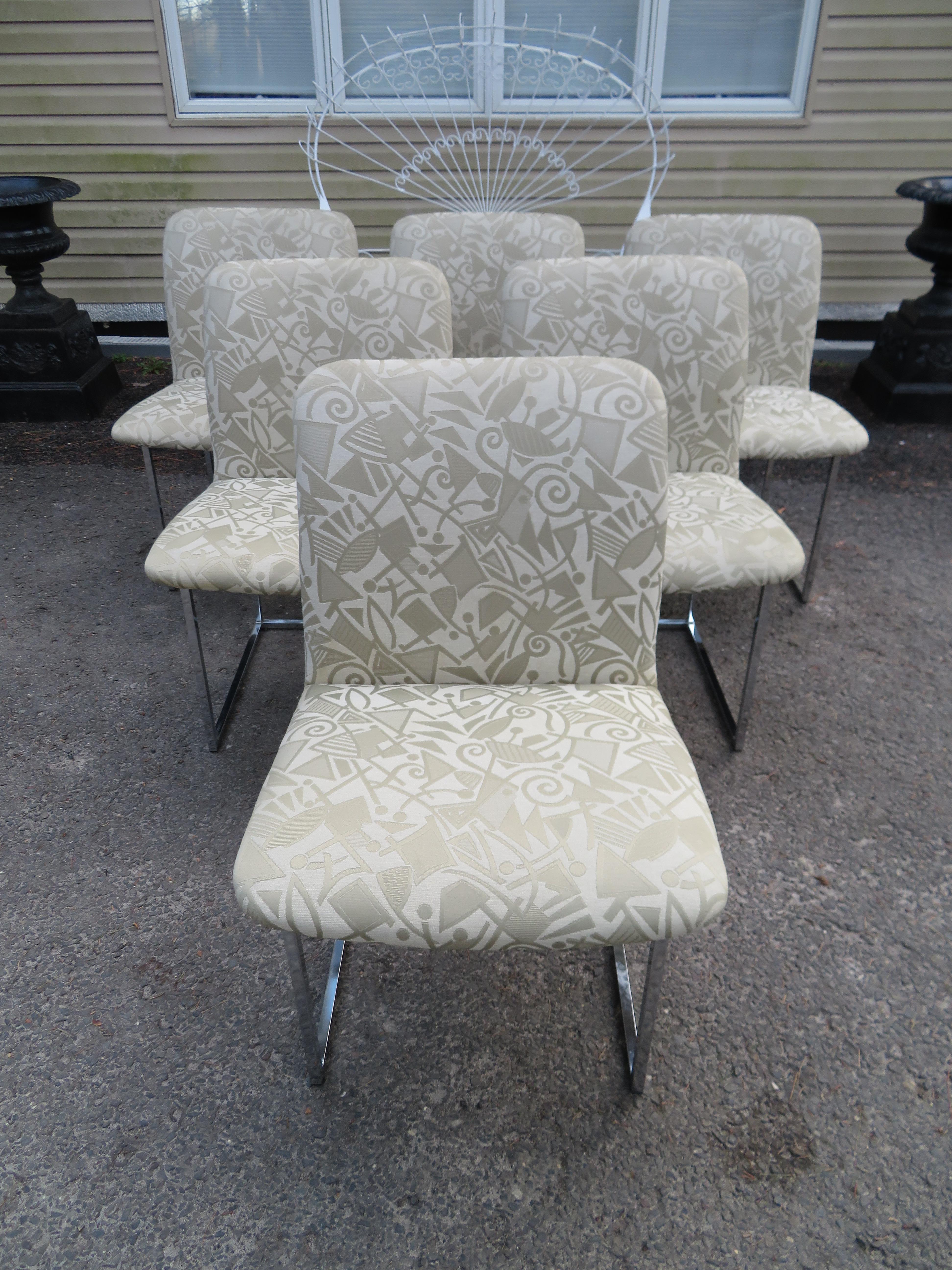 Lovely set of 6 Design Institute of America chrome dining chairs. We love the thin square frame with the lower backs. 
 
