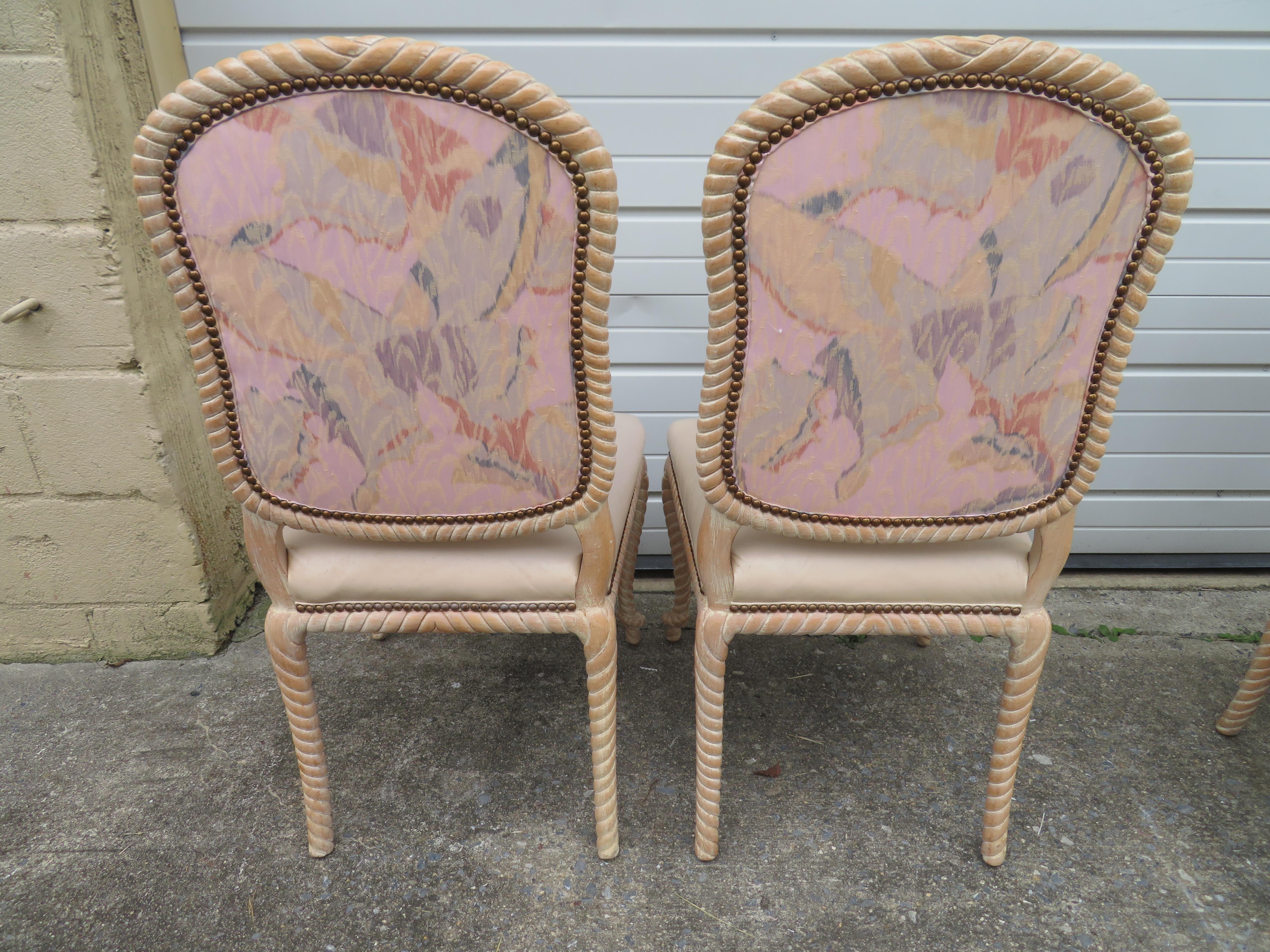Lovely set of 4 vintage carved rope dining chairs with original leather upholstery. We love the cerused cream colored finish along with the original leather upholstery all in nice vintage condition.