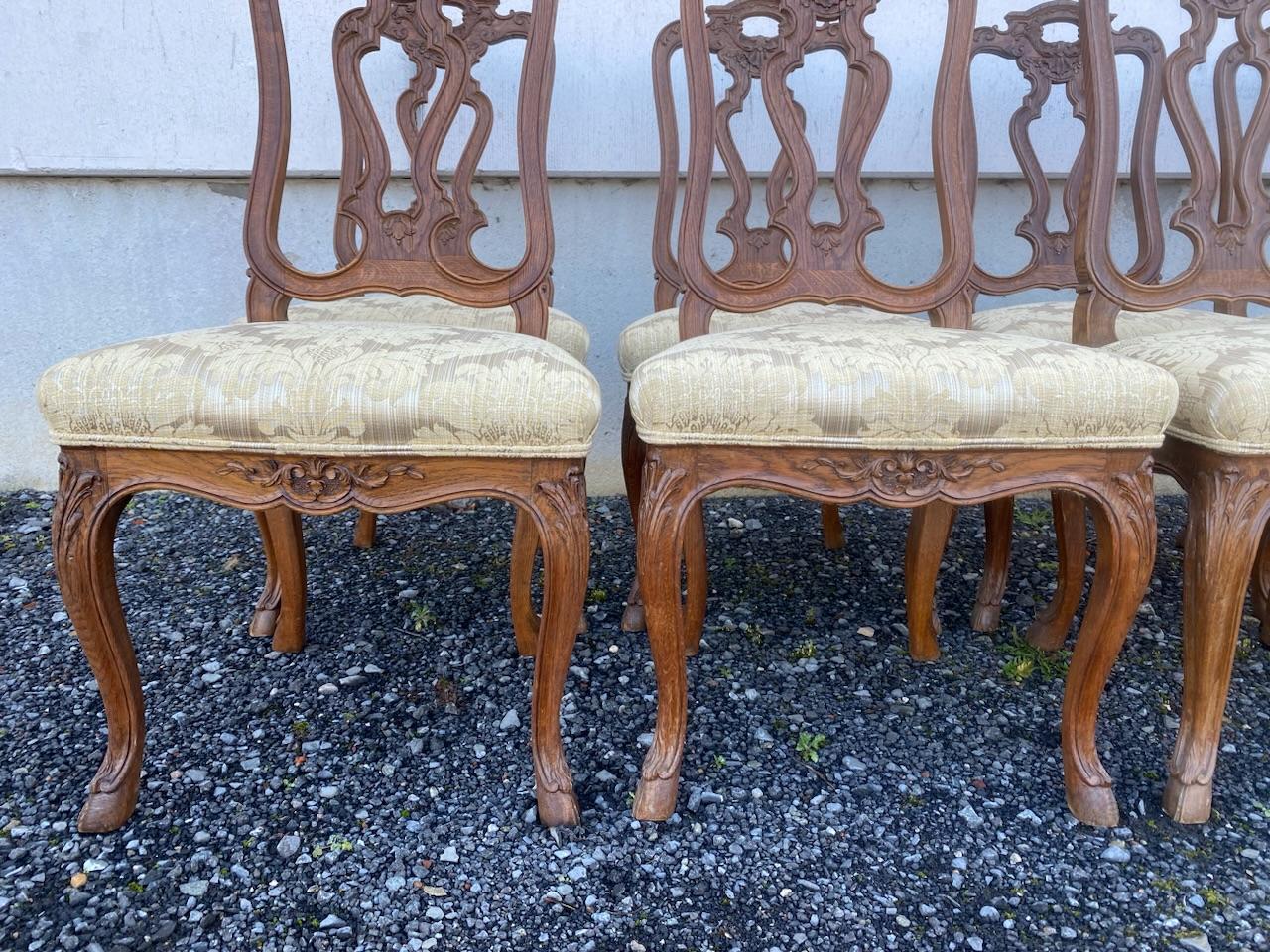 A really nice and very good quality set of 8 dining chairs. Originating from France and dating to around 1900. They are all strong and sturdy and the upholstery is in pretty good condition with just a few stains but the internal sprung upholstery is