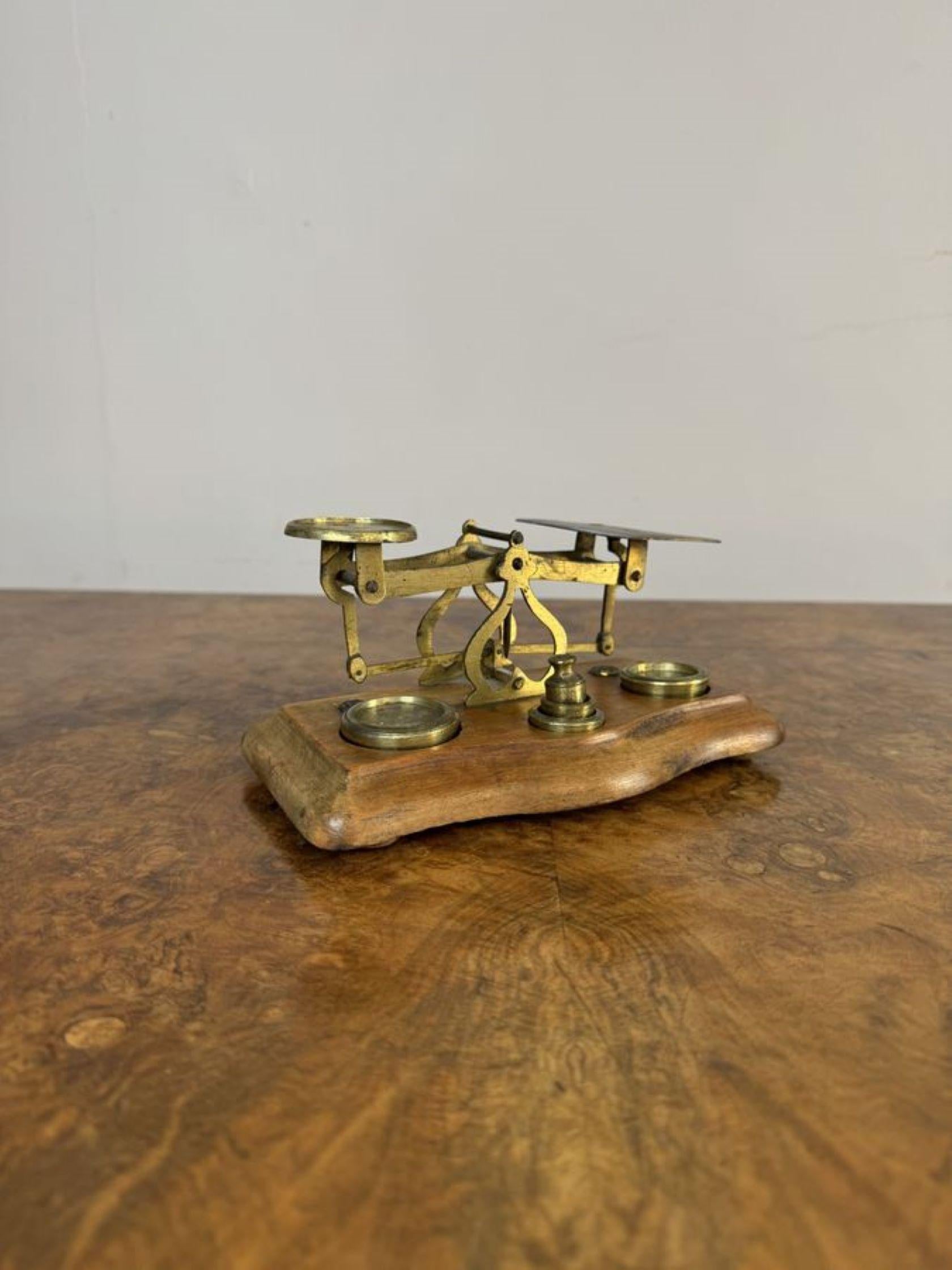 Lovely set of antique Edwardian postal scales & weights, having a lovely pair of antique Edwardian brass postal scales with brass weights mounted on a wooden shaped base.

D. 1910
