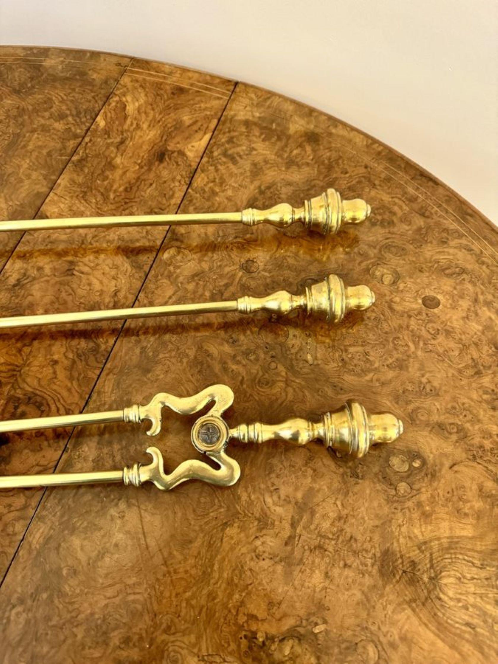 Lovely set of antique Victorian quality brass fire irons having a quality set of fire irons with circular shaped handles, consisting of a lovely shaped shovel, poker and a pair of tongs.

D. 1880
