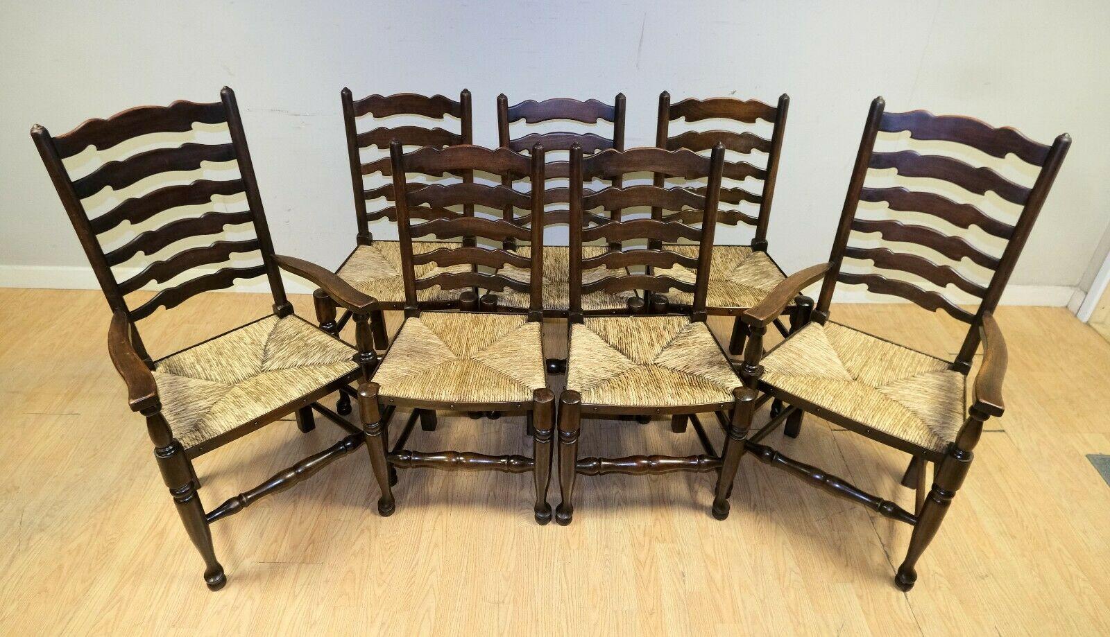 We are delighted to offer for sale this lovely set of eight Elm ladder back rush seat dining chairs including two carvers.

A stunning and well made suite which are made of solid Elm. The seats come with the original rush seat. The back ladder