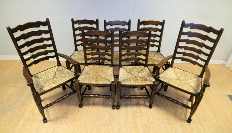 We are delighted to offer for sale this lovely set of eight Elm ladder back rush seat dining chairs including two carvers.

A stunning and well made suite which are made of solid Elm. The seats come with the original rush seat. The back ladder