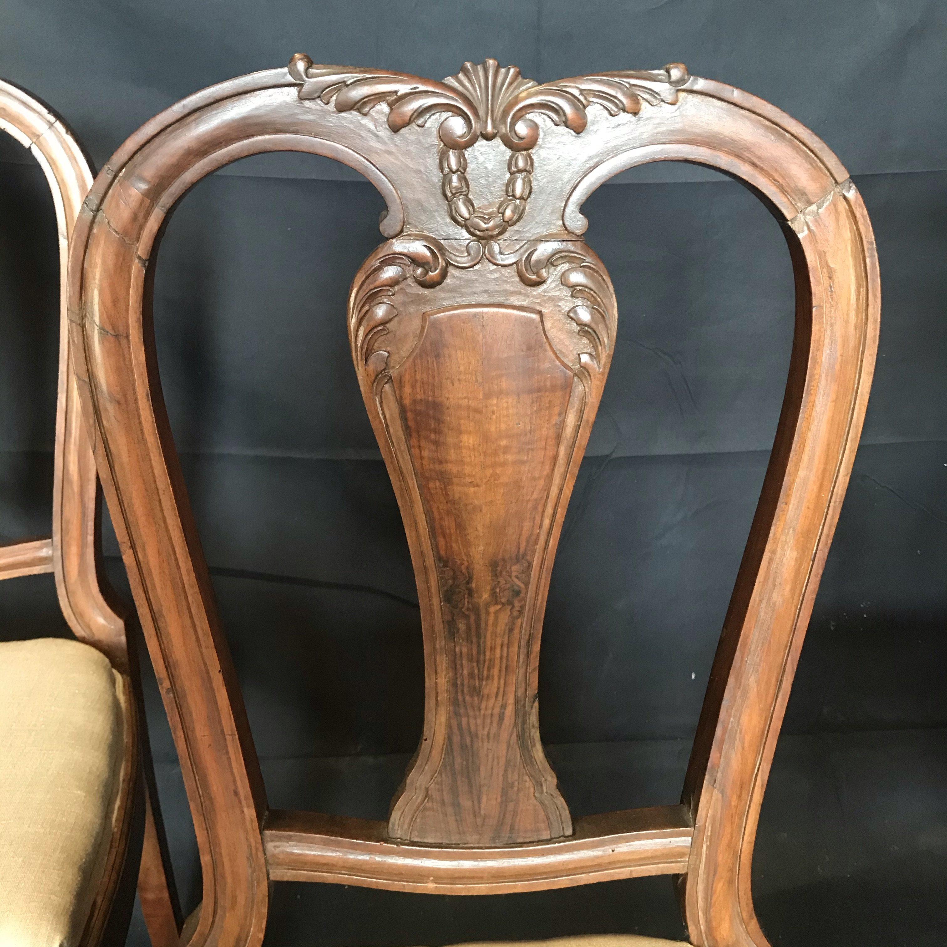 This set of four walnut English side dining chairs have wonderful decorative carvings, cabriole legs that terminate with ball and claw feet, and new French linen blend upholstery.
#4776.
 








 