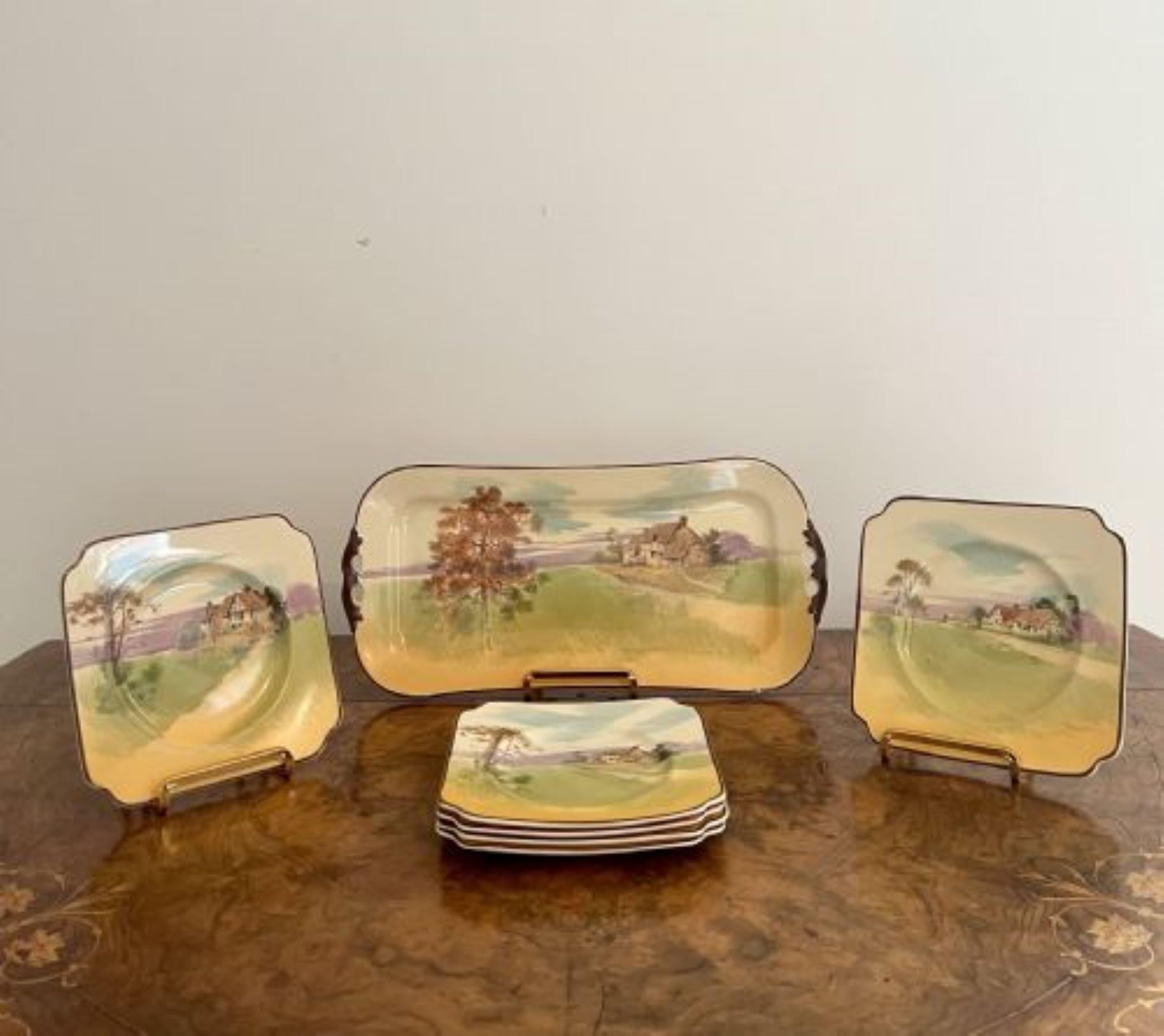 Lovely set of seven antique Royal Doulton sandwich plates having a set of six Royal Doulton plates and a matching large serving plate, decorated with different scenes with old cottages and houses in rural settings hand painted in wonderful yellow,