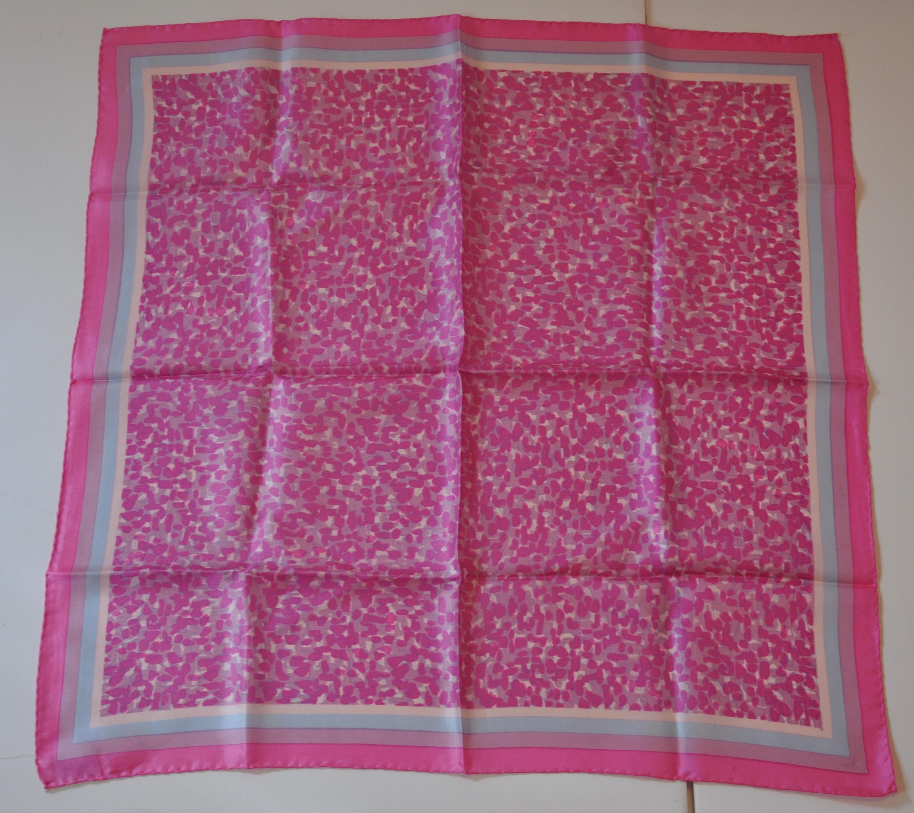         This simply wonderful lovely shades of fuchsia specks accented with lavender striped borders silk scarf measures 21 inches by 21 inches, with hand-rolled edges. Made in Japan.