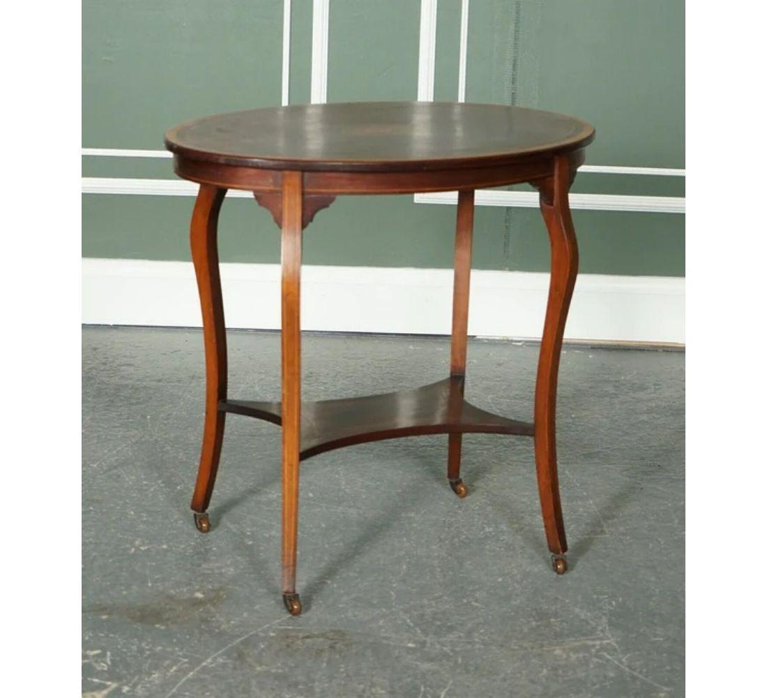 We are delighted to offer for sale this lovely sheraton revival oval late Victorian side end wine lamp table.

Very lovely table with a Sheraton revival inlay on top, which is very decorative.

We have lightly restored this by cleaning it, hand