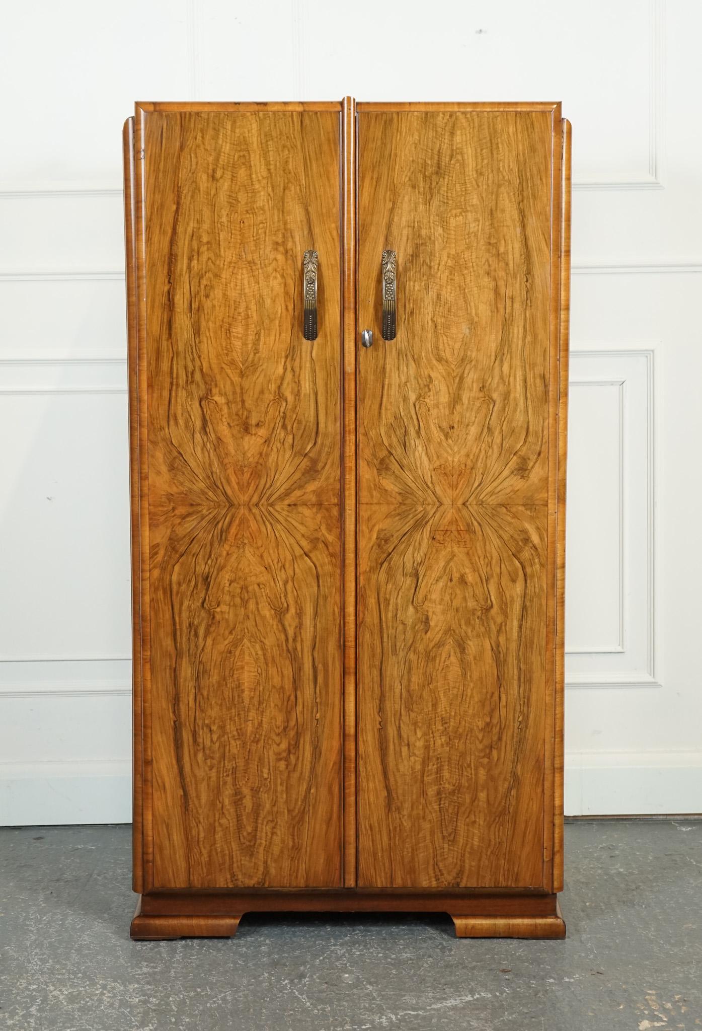 

We are delighted to offer for sale this Burr Walnut Art Deco style small wardrobe is a stylish and elegant piece of furniture that combines the rich beauty of burr walnut wood with the sleek lines and geometric shapes characteristic of the Art