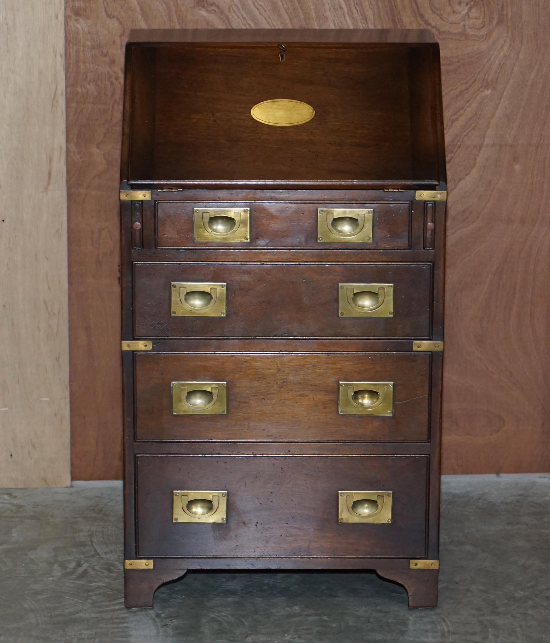 We are delighted to offer this lovely small R.E.H Kennedy made, Harrods London retailed military campaign bureau desk in mahogany with brass fittings

A good looking and well made piece. This is ideally suited as a work station for a compact area.