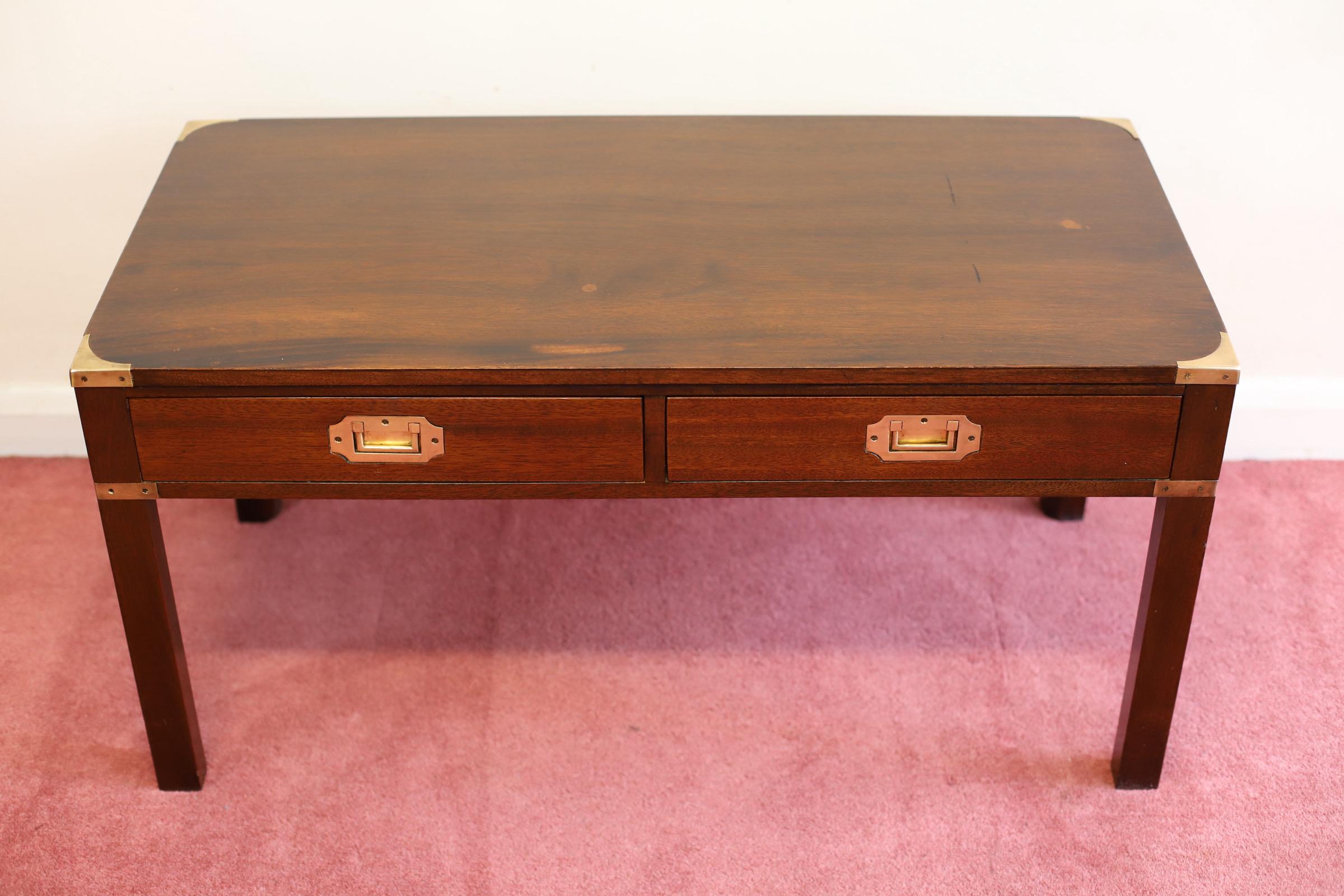 We delight to offer for sale this beautiful mahogany small military campaign table , with brass corner fittings and sunken military brass handles and two drawers on the front , in good condition.
Don't hesitate to contact me if you have any
