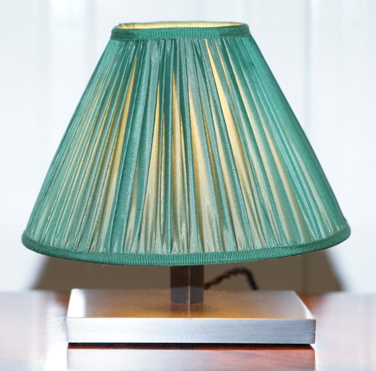 We are delighted to this lovely small table lamp with green shade

A good looking and functional little lamp, the shade filters the light nicely and it comes through the fabric

Dimensions

Height 18.5cm

Width 20cm

Depth 20cm

Please