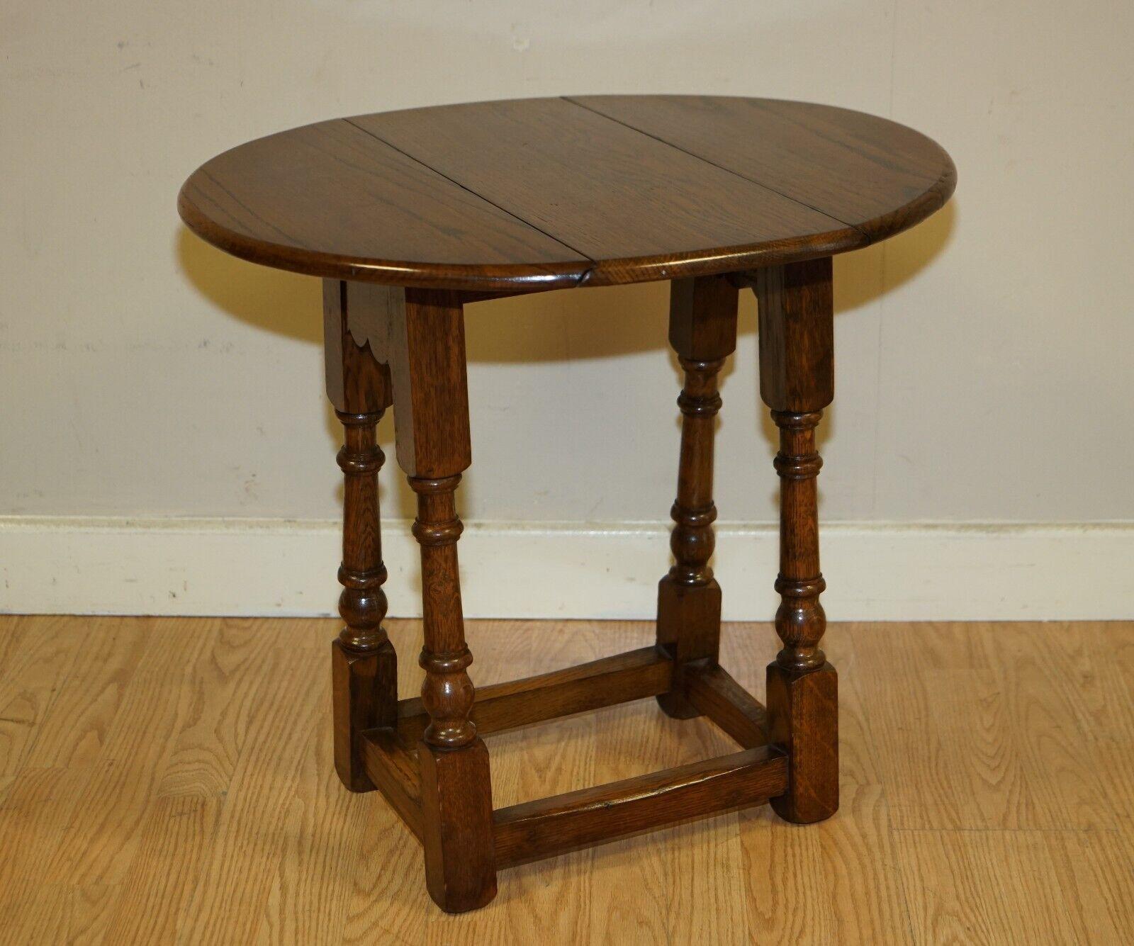 Here we have for sale this lovely well-made small vintage drop leaf, folding side, end, sofa, table. This table has multiple uses, perfect at the end of the sofa for a glass of wine, to stand a lamp or plant. It has been waxed and polished and ready