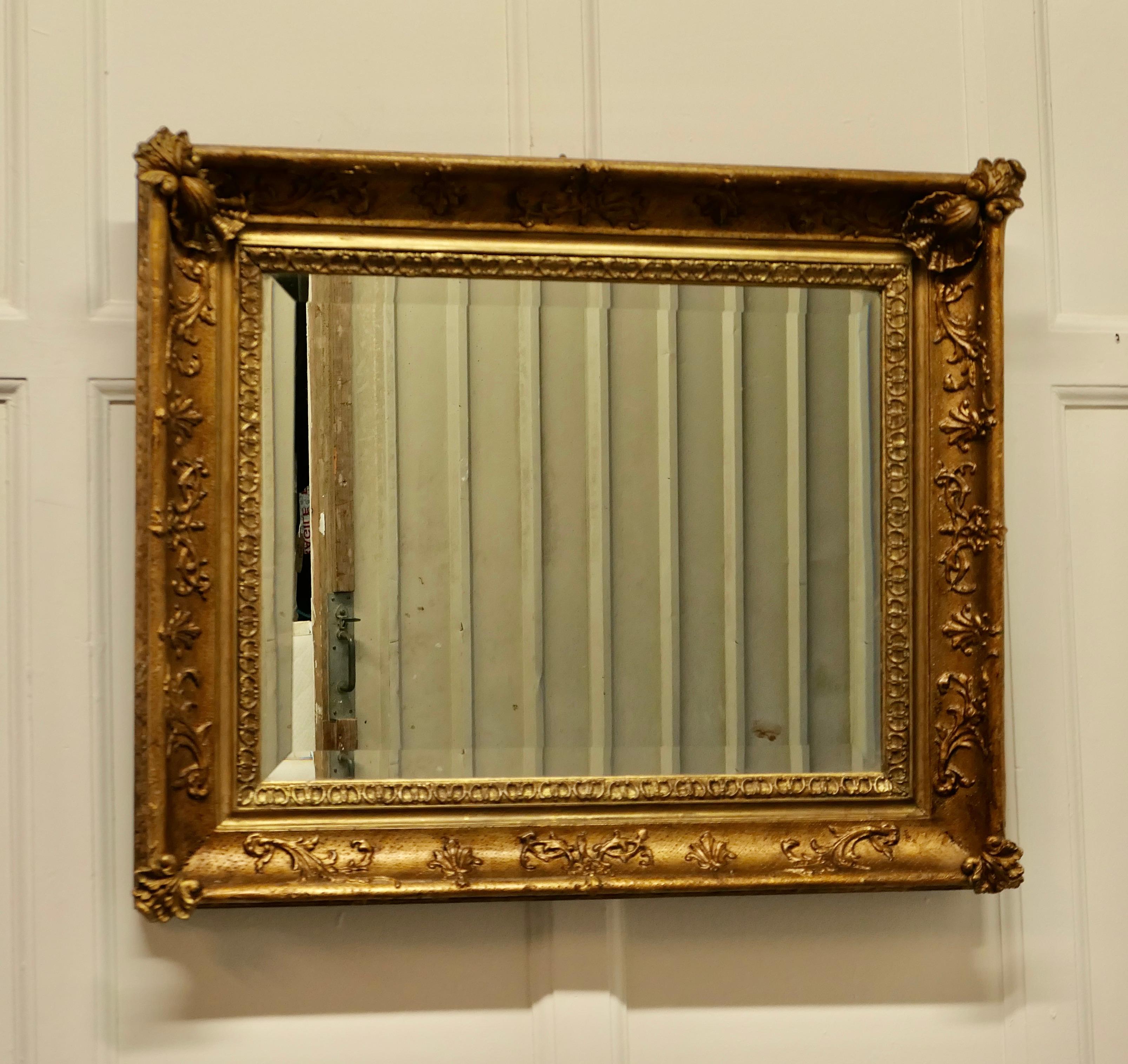 Lovely square gilt rococo wall mirror.

The mirror is in a Gilt Rococo Style Frame, it is almost square in shape with a 4” wide decorated frame
This is a beautiful and quite elaborate piece, the bevelled glass and frame are in good condition for