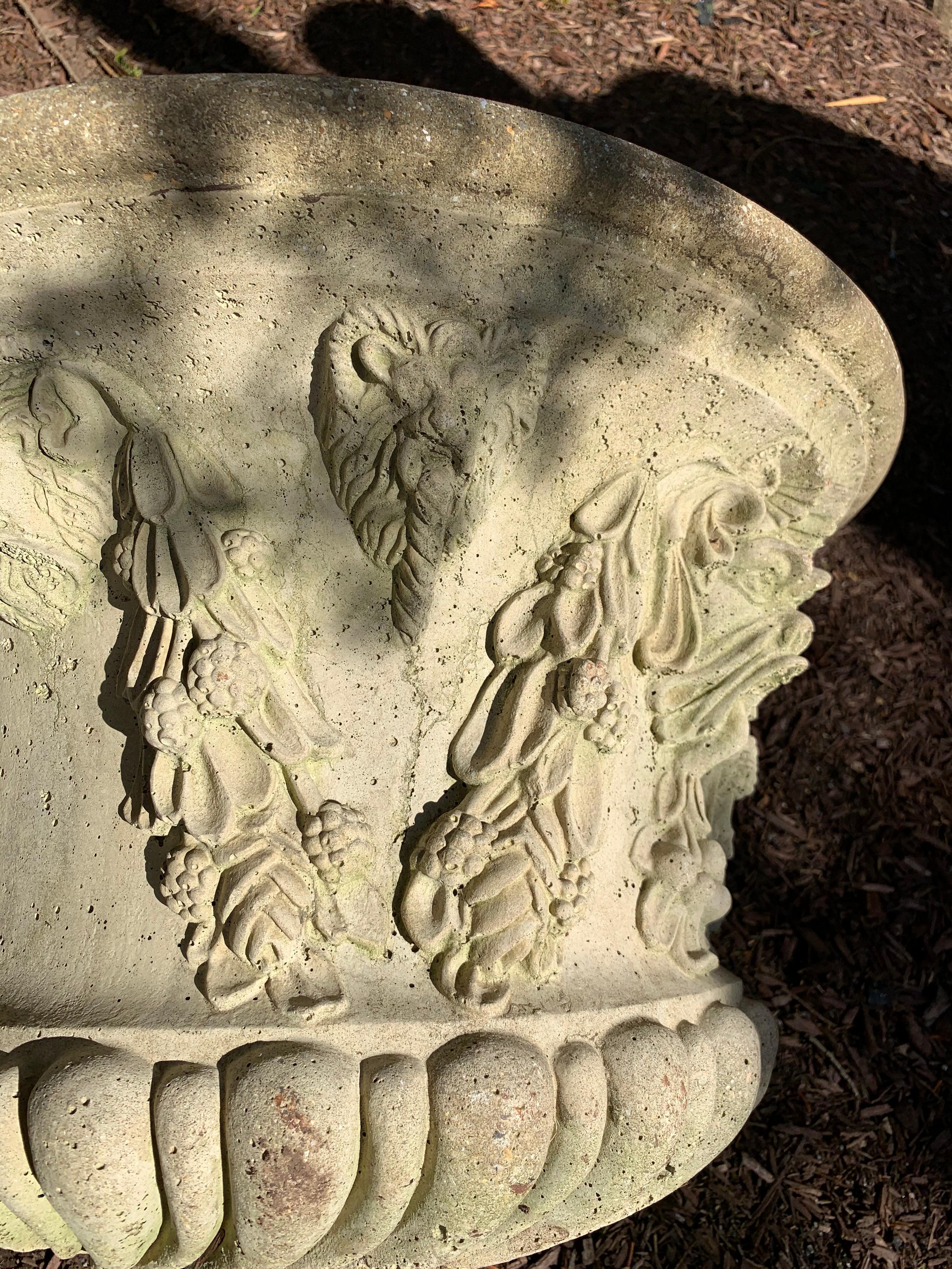 Beautiful vintage stone planters urns having ornate floral relief decoration.
   