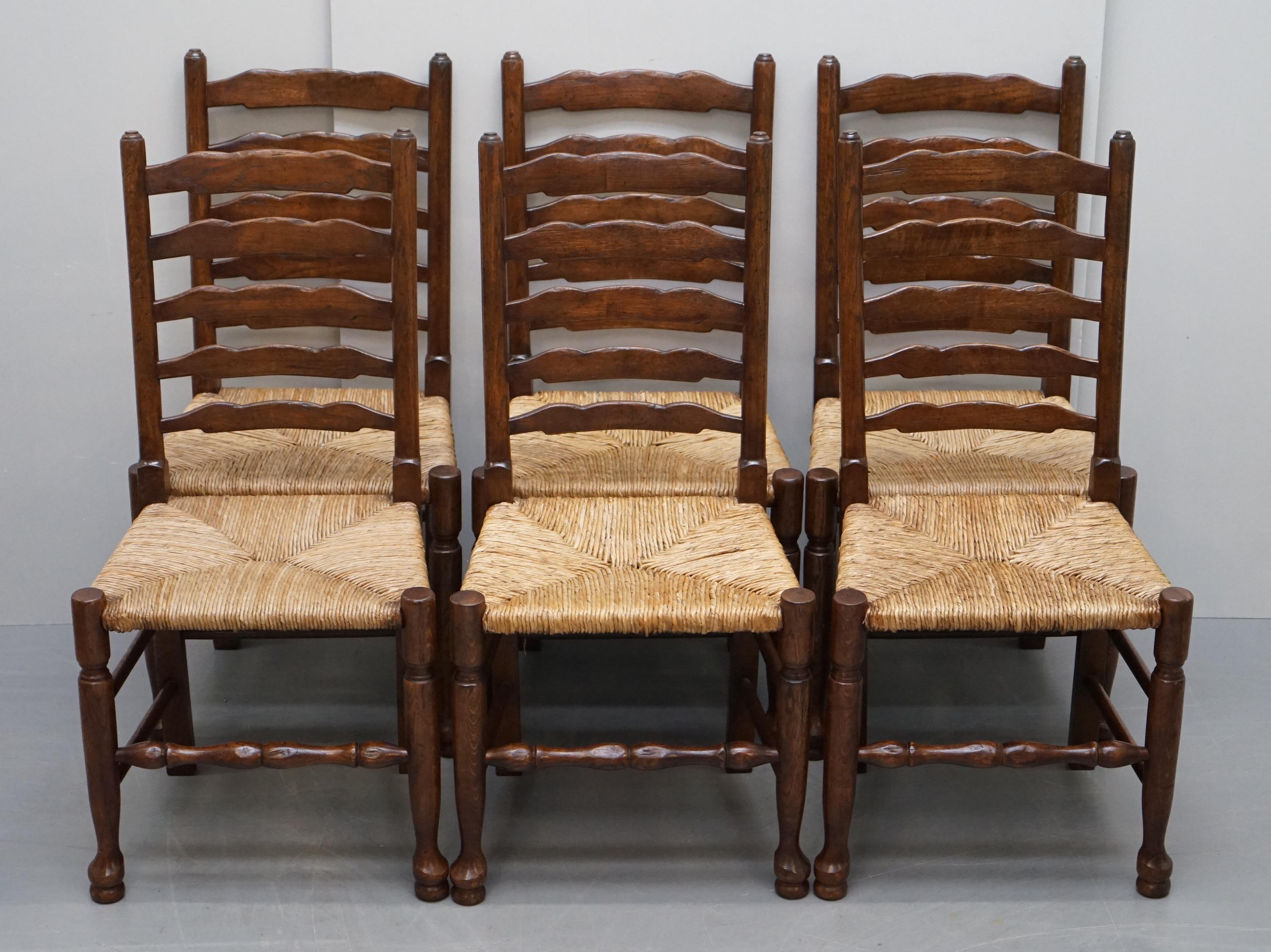 We are delighted to offer for sale this lovely suite of eight original Dutch circa 1880 Ladder back rush seat dining chairs including two carvers

A very good looking and well made suite, the timber is all solid elm, the seats are the original