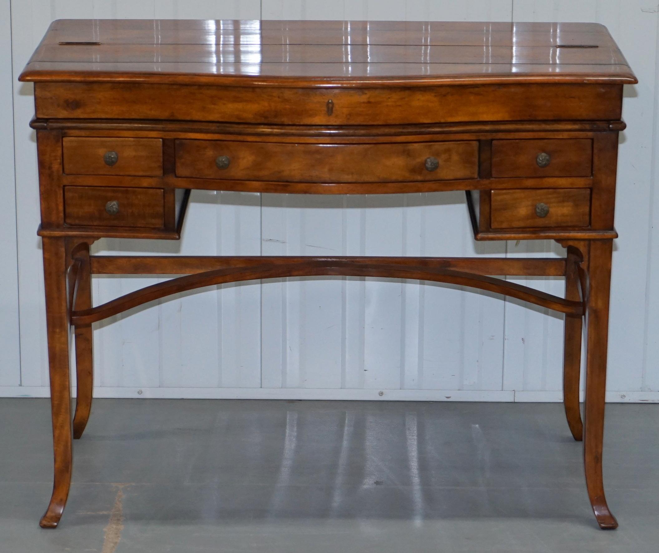 We are delighted to offer for sale this absolutely stunning Theodore Alexander the Residency fold-out writing table desk with hand dyed brown leather writing surface

A truly exquisite piece, as it stands it’s a very usable writing table that’s