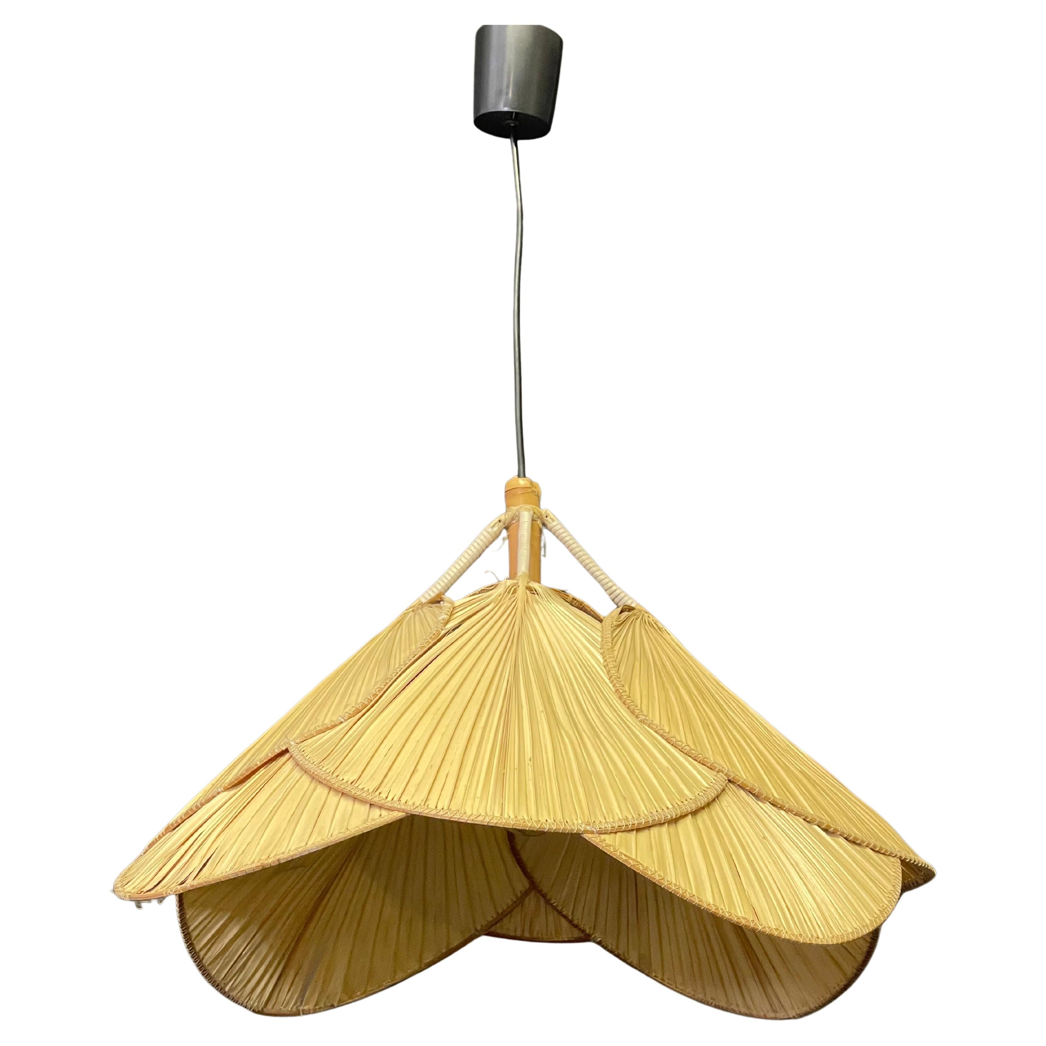 A rare and lovely Uchiwa pendant in the Style of Ingo Maurer, Germany, 1970s.
Bamboo and 8 paper fans.
 