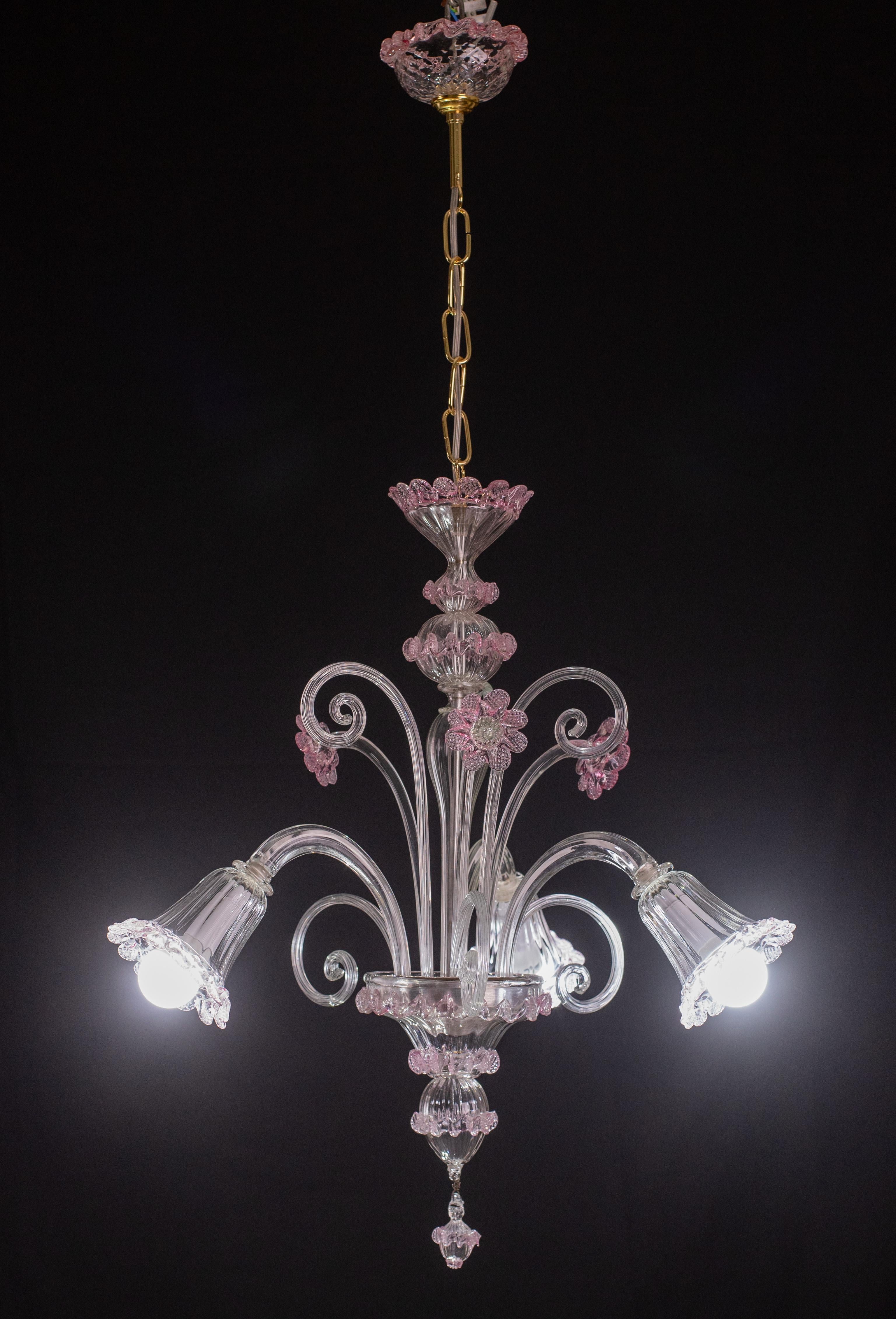 Pretty Murano chandelier, typical classic Venetian.

The chandelier has 3 arms that mount 3 e14 light points, European standards, possible to rewire for Usa.

The fixture is full of leaves and flowers, 3 high leaves, 3 low leaves and 3 flowers.

The