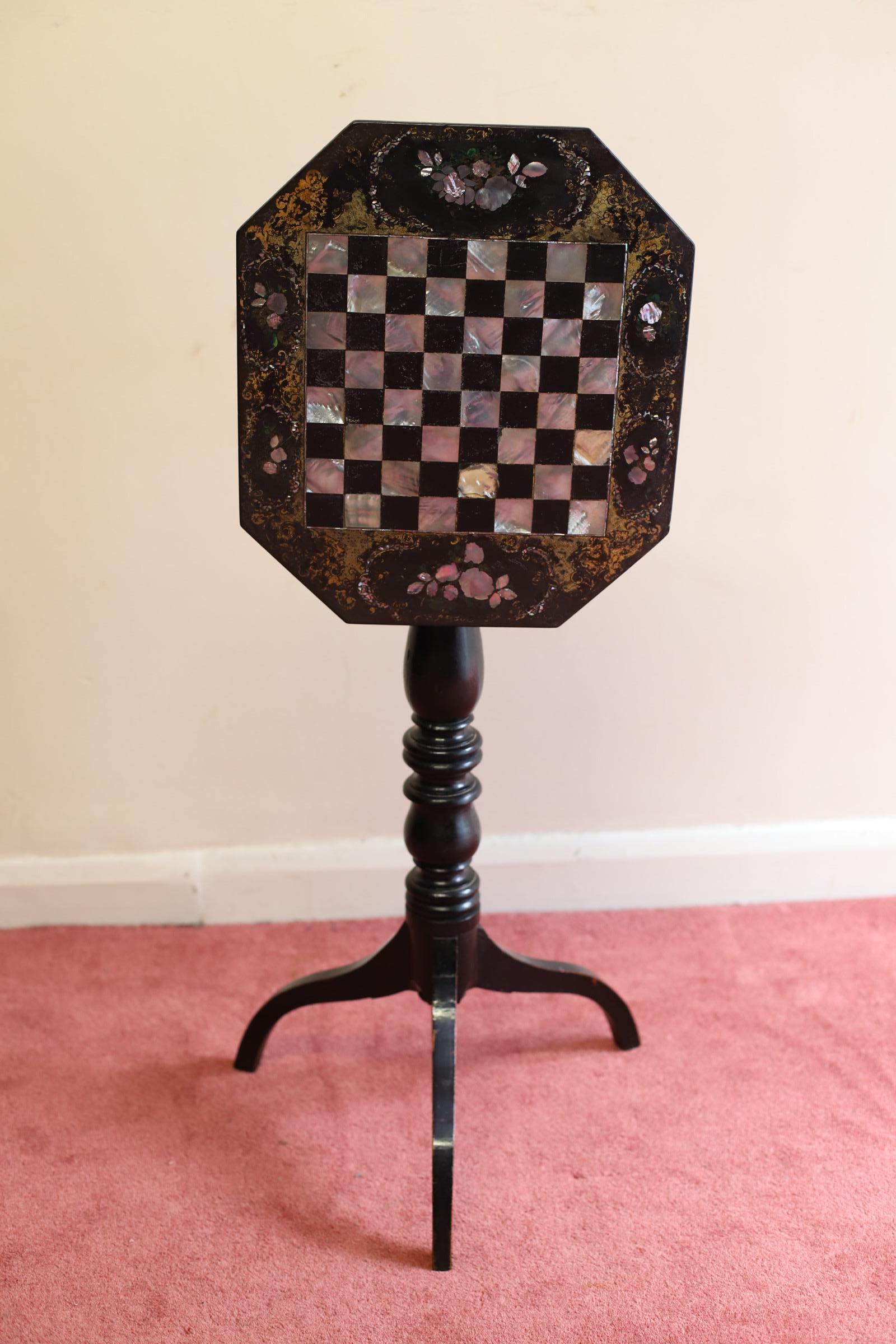 We delight to offer for sale an early Victorian ebonized and papier-mâché tip-top games table, the top inlaid with a mother-of-pearl chessboard, this table it was made by Jennens and Bettridge between 1840-1850 . 
The firm of Jennens & Bettridge was