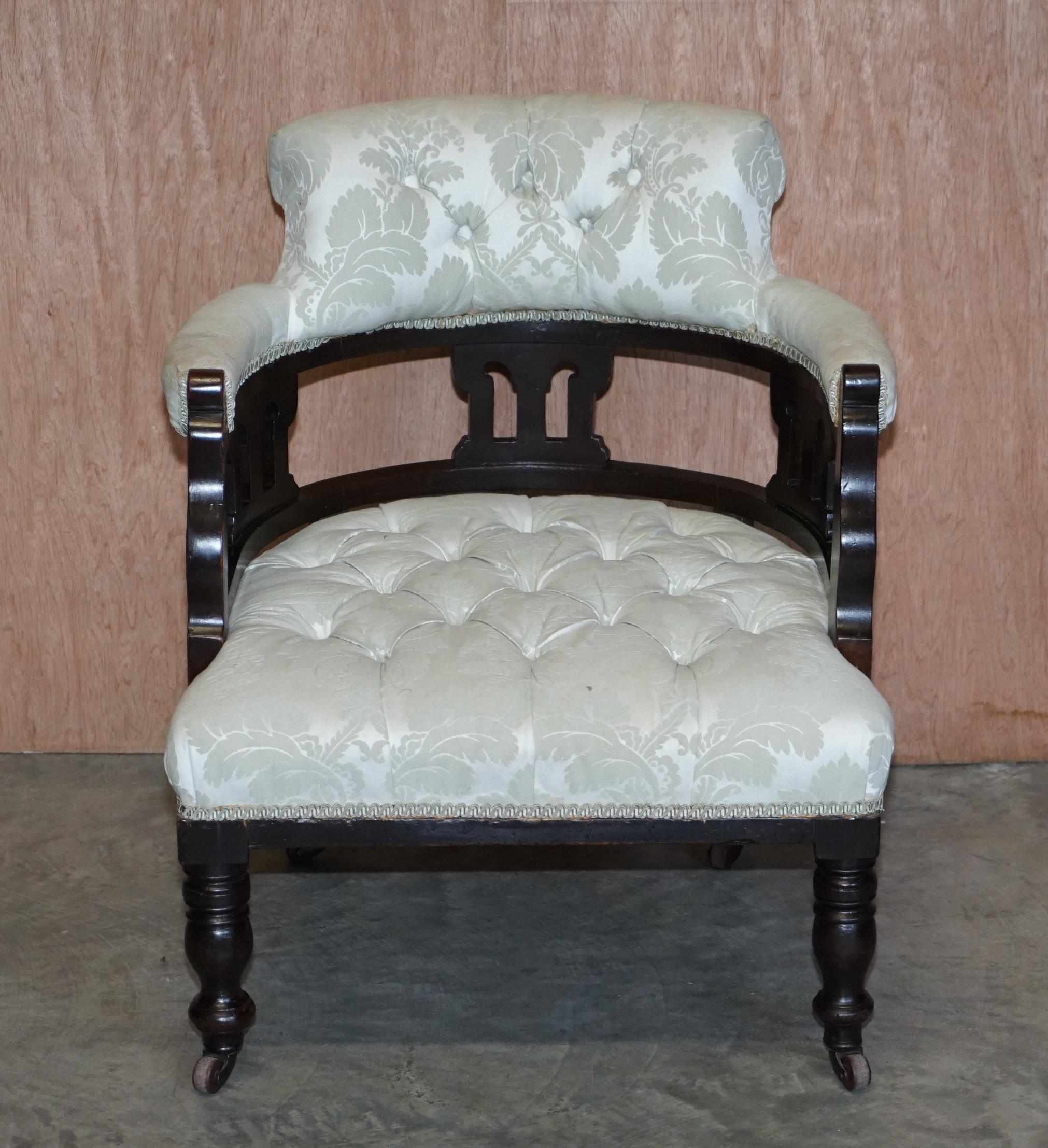 We are delighted to offer for sale this lovely original circa 1880 Victorian occasional captains armchair

A very good looking period piece, upholstered in fabric with chesterfield buttoning, the form is that of a Library reading occasional