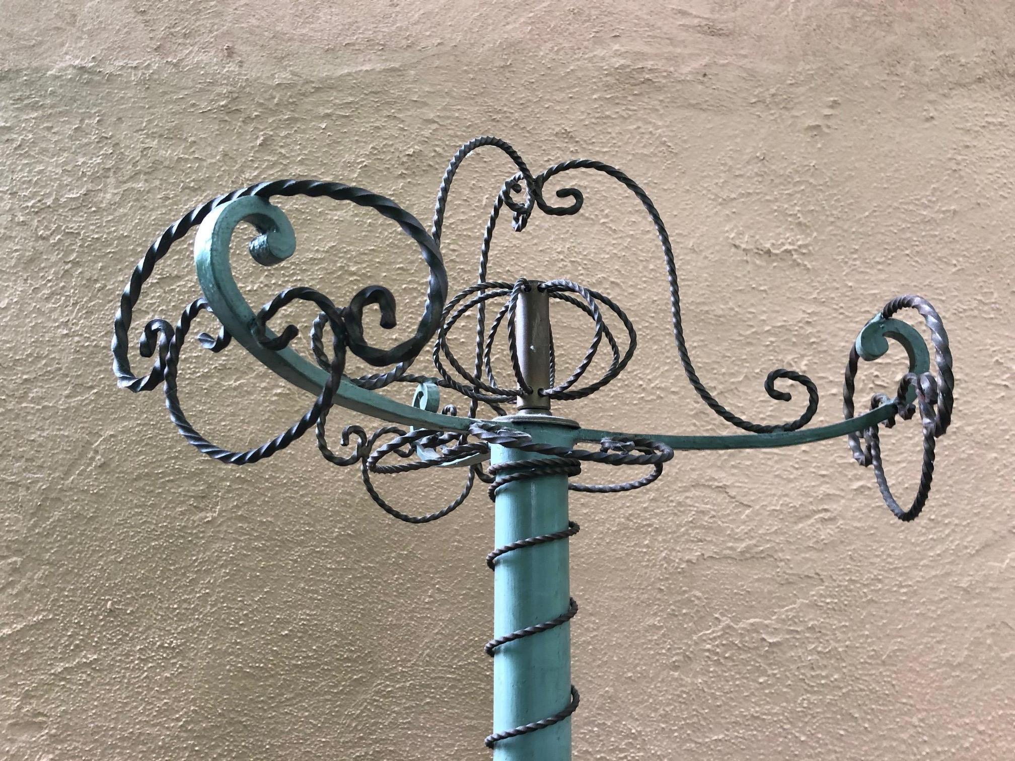 Vintage coat rack having a celadon painted column and old curlicue iron decoration and places for hanging jackets.
Top is 17.5 diameter.
Bottom 22 diameter.