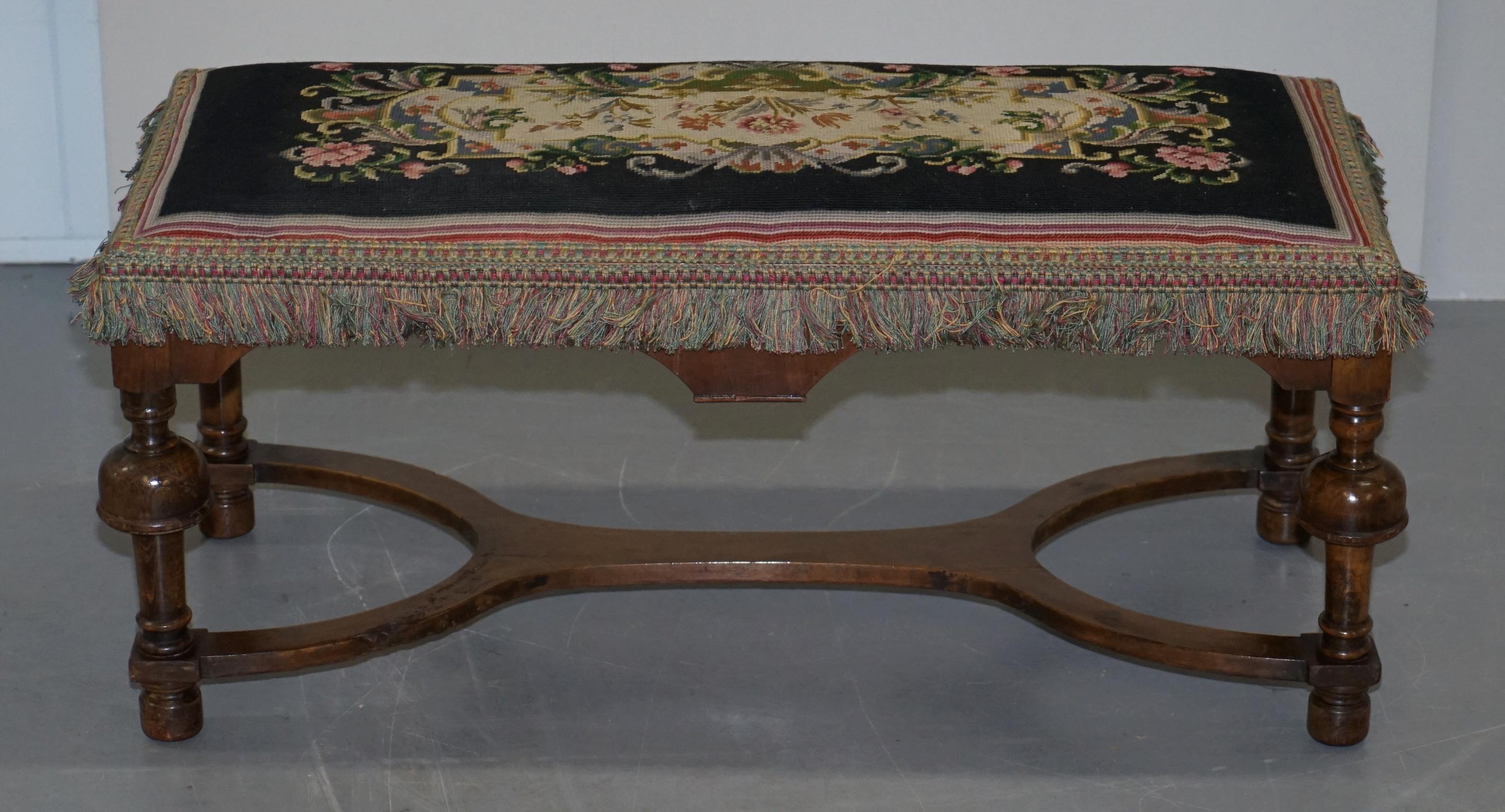 We are delighted to offer for sale this lovely Victorian bench stool made in the William and Mary style

The frame is nicely carved from solid walnut, the embroidery is period Victorian and finished to a very high standard

In terms of the