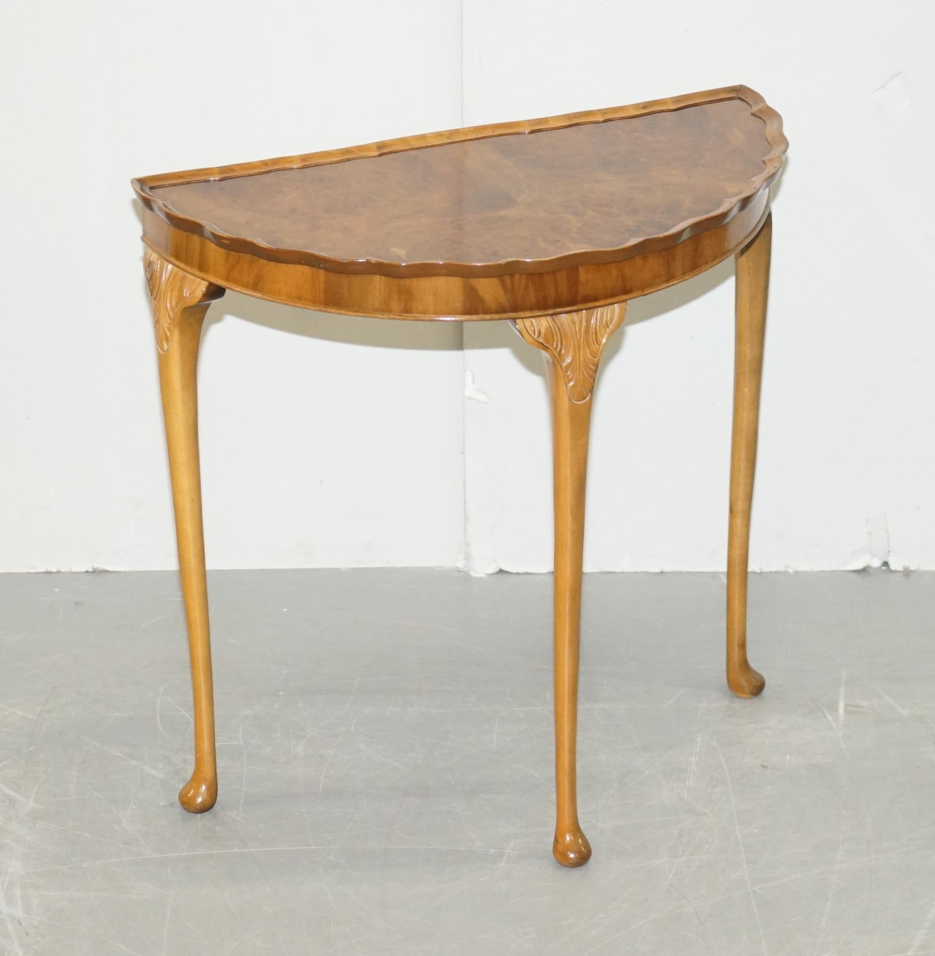 We are delighted to offer this lovely vintage Art Deco style burr walnut demi lune console side table

A very well made and good looking piece, its very decorative, the burr walnut has a rich warm patina, the scalloped edge is a detail you don’t