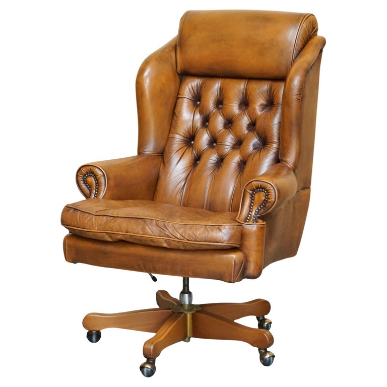 tobacco leather office chair Antique Wingback Tufted Distressed Leather Chair Introduce an element of sophistication to any workspace with this regal office chair that features a stunning wingback design with nailhead detailing on the seatback Albion Tobacco Lamont Leather Dining