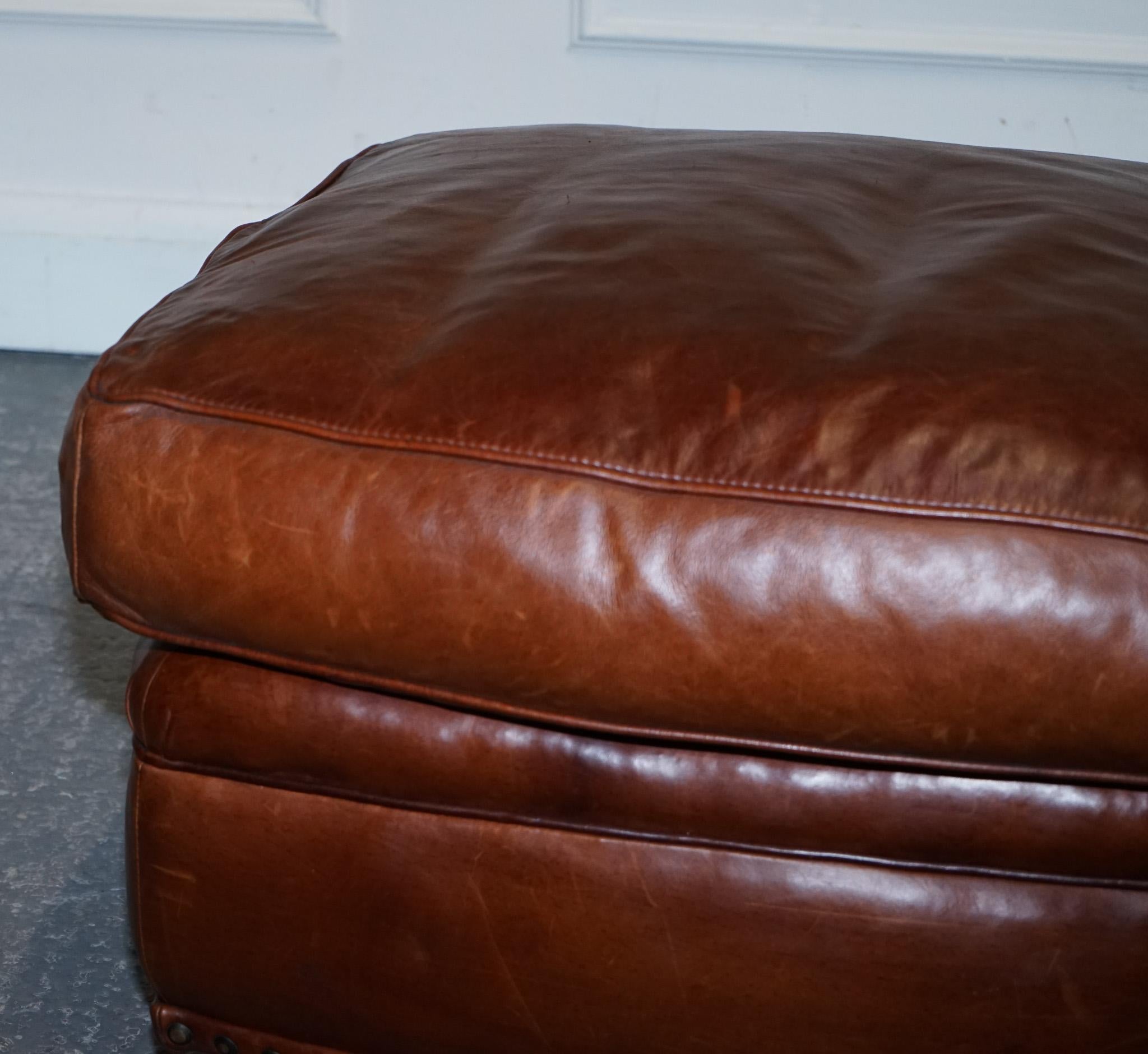 Hand-Crafted LOVELY VINTAGE BROWN LEATHER FOOTSTOOL FEATHER FILLED BRASS STUDS DETAiL For Sale