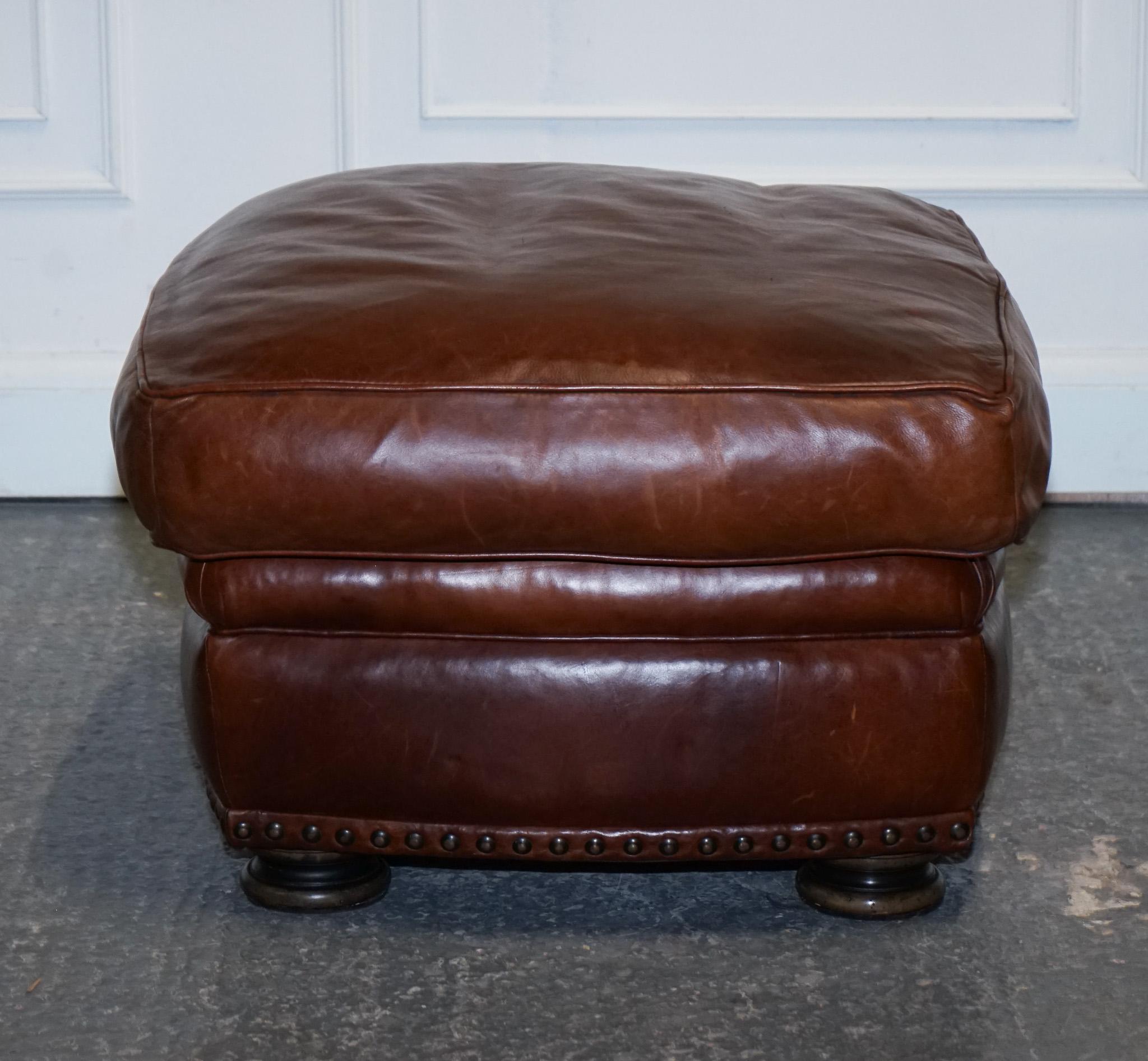20th Century LOVELY VINTAGE BROWN LEATHER FOOTSTOOL FEATHER FILLED BRASS STUDS DETAiL For Sale