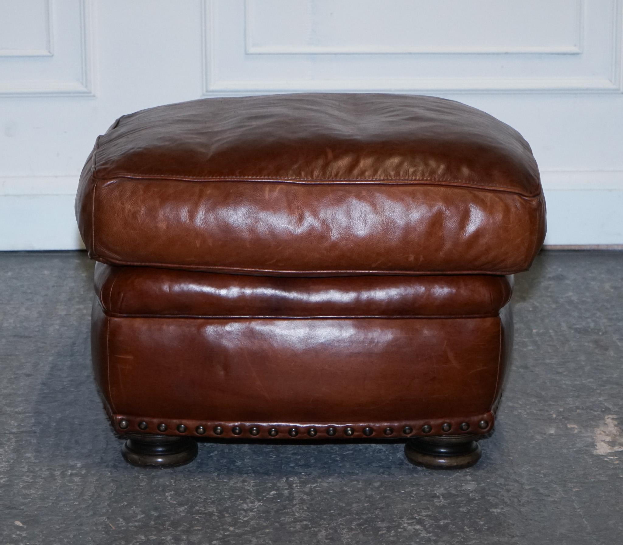 LOVELY VINTAGE BROWN LEATHER FOOTSTOOL FEATHER FILLED BRASS STUDS DETAiL For Sale 1