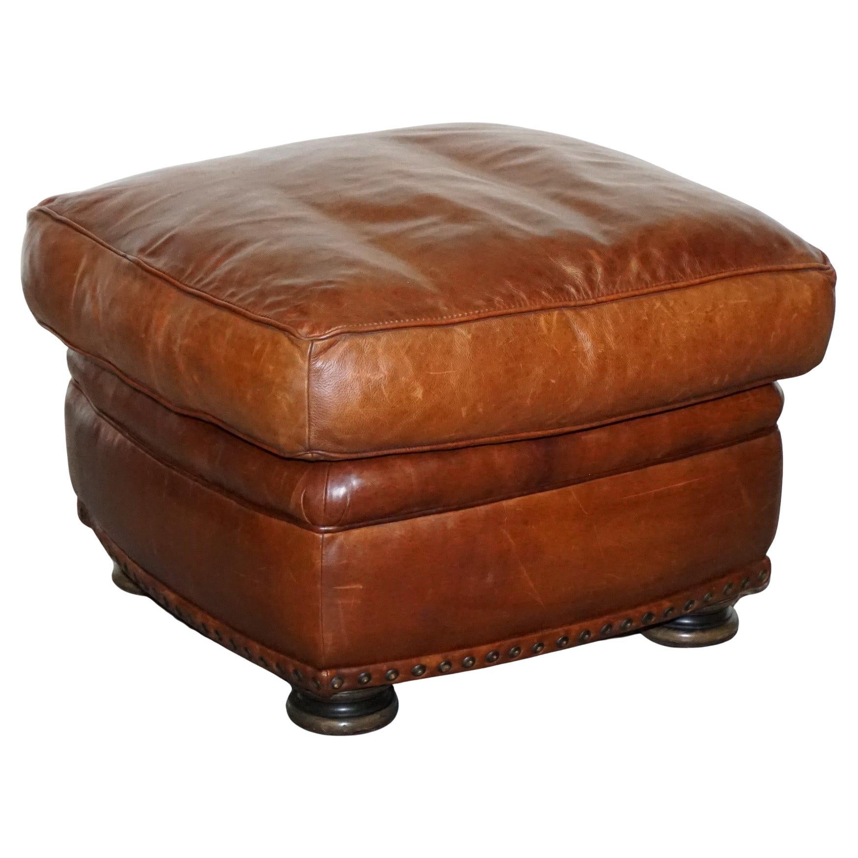 LOVELY VINTAGE BROWN LEATHER FOOTSTOOL FEATHER FILLED BRASS STUDS DETAiL For Sale
