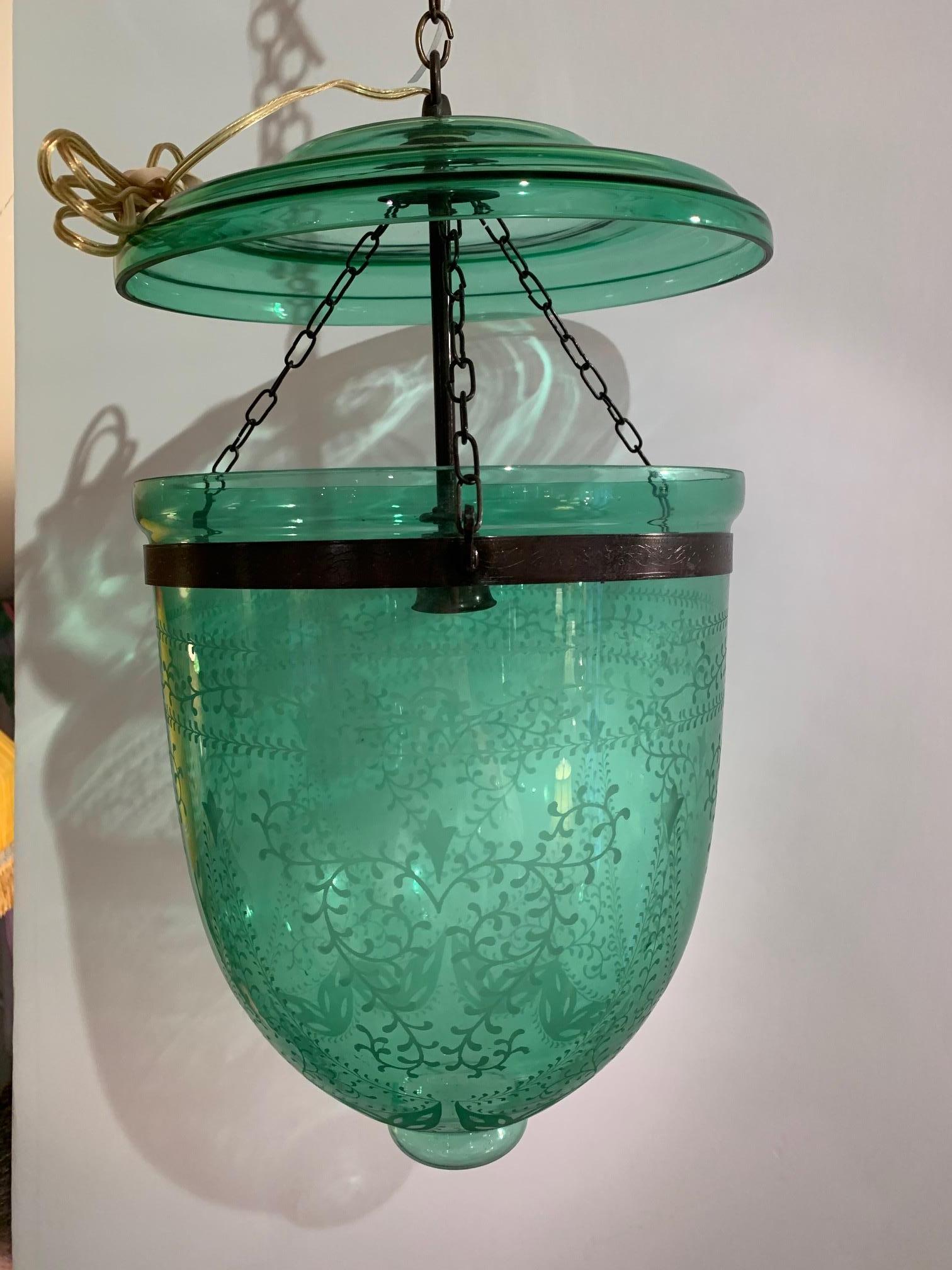 A lovely green etched glass light pendant having a bell jar shape. New socket and rewired.