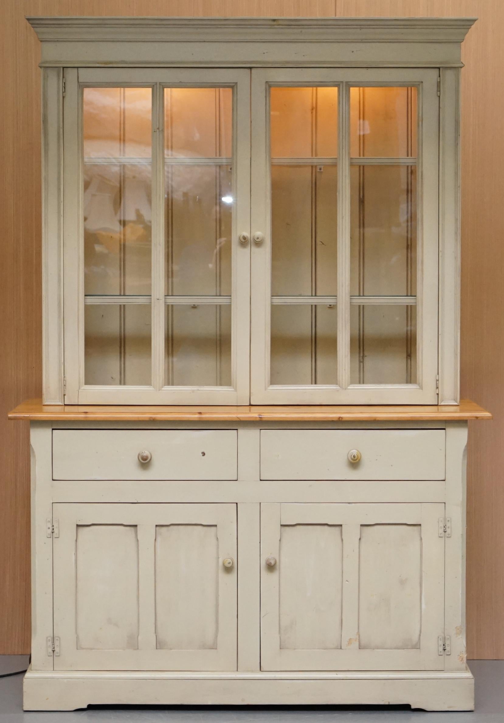 We are delighted to offer for sale this lovely vintage French Farmhouse country style hand painted welsh dresser bookcase with built in lights and glass shelves

A lovely and very well made piece, the top section has twin spot lights, the shelves