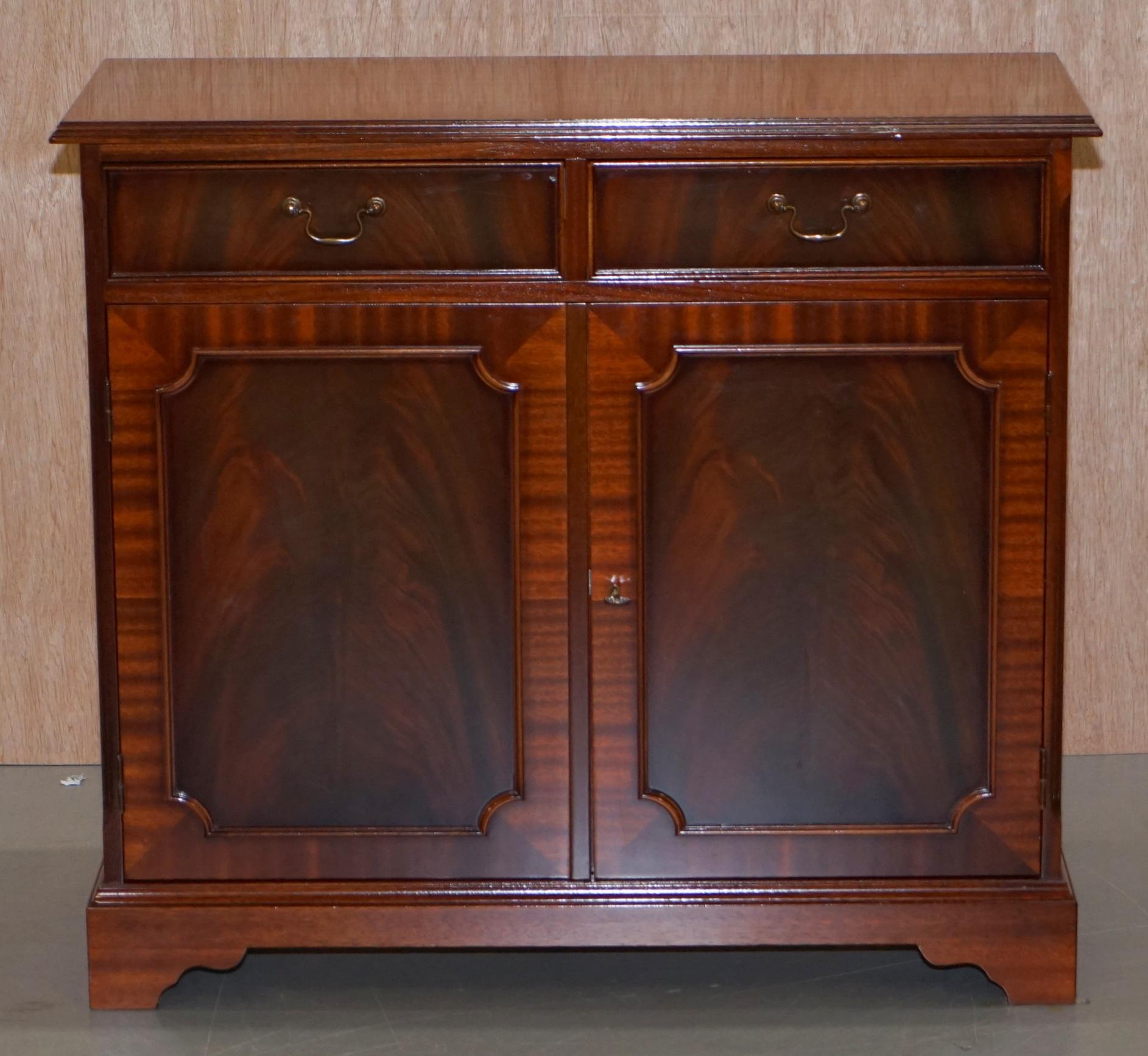 We are delighted to offer for sale this very well made flamed mahogany cupboard with twin drawers to the top

A very good looking and well made piece, it has one large cupboard base with single removable shelf and two good sized drawers. The back