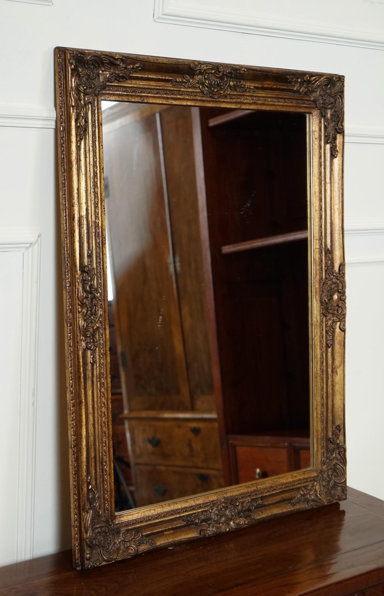 

We are delighted to offer for sale this Vintage French Gold-gilted Wall Mirror.

 A stunning piece with intricate detailing that showcases an elegant and timeless design. Its frame is crafted from high-quality material, featuring intricate