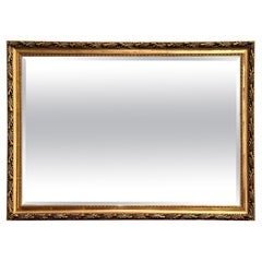 Ravissant miroir vintage biseauté orné d'or