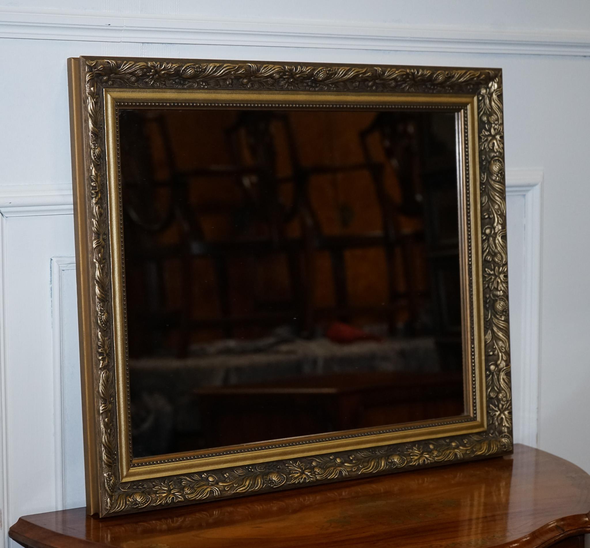 
We are delighted to offer for sale this Lovely Gold Ornate Bevelled Mirror.

A Vintage Gold Ornate Bevelled Wall Mirror is a beautifully crafted and elegant piece of decor that adds a touch of vintage glamour to any room. This particular mirror