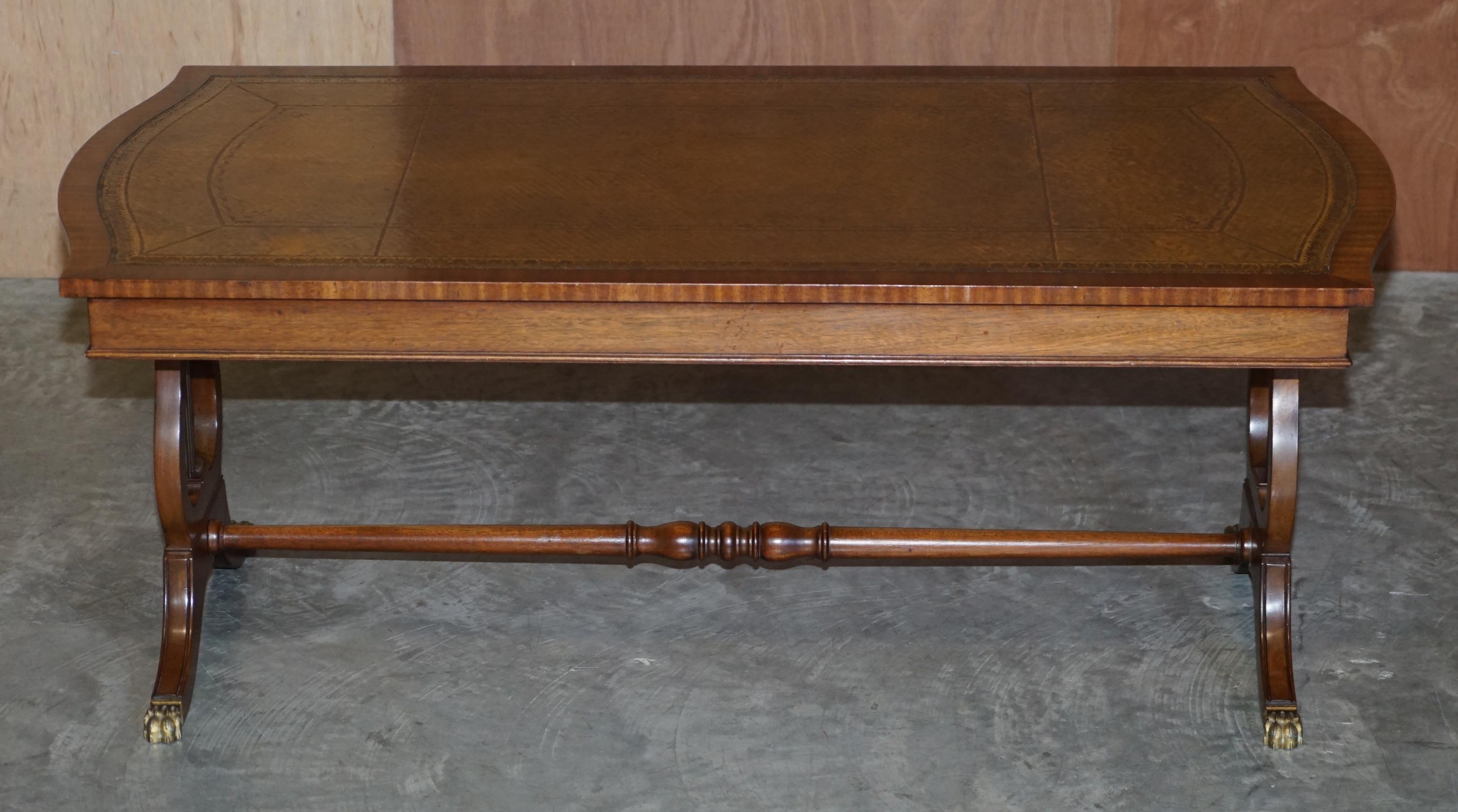 We are delighted to offer this stunning hand made in England mahogany and brown leather large coffee or cocktail table

A very decorative and well made piece, the top is upholstered with heritage leather which is hand dyed this lovely cigar brown
