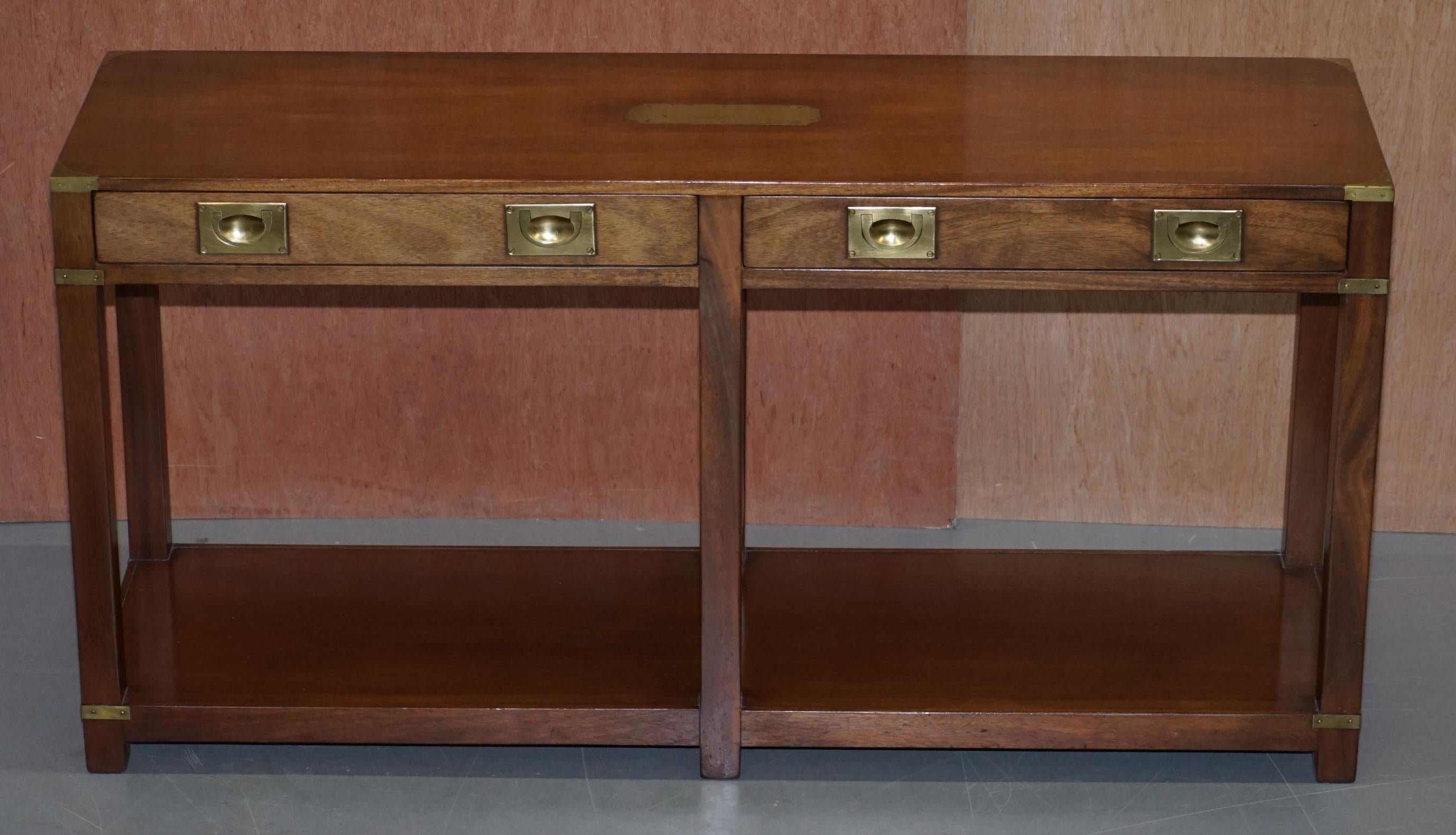 We are delighted to this lovely handmade in England Harrods London mahogany Military Campaign console table with drawers

Kennedy was Harrods oldest concession, they retailed with them for over 87 years

This piece is made in the highly